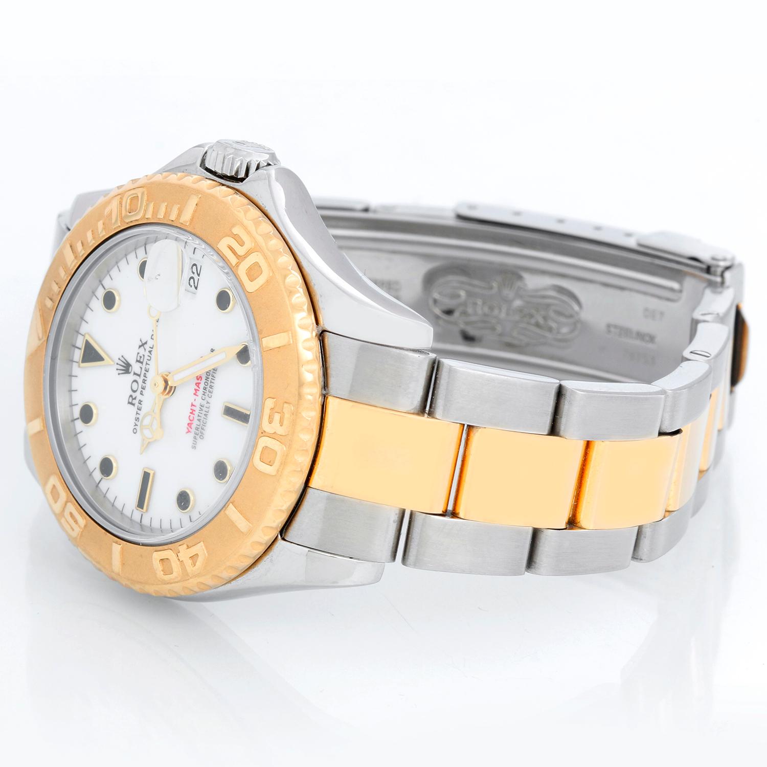 Rolex Midsize Yacht-Master 35mm Steel & Gold Men's or Ladies Watch 168623 - Automatic winding; sapphire crystal. Stainless steel case with 18k yellow gold bezel . White dial. Stainless steel and 18k yellow gold Oyster bracelet with flip-lock clasp.