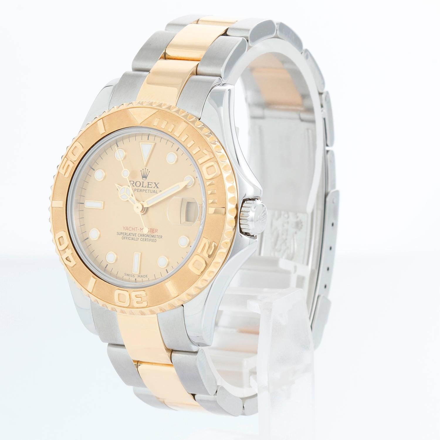 Rolex Midsize Yacht-Master 35mm Steel & Gold Men's or Ladies Watch 168623 - Automatic winding; sapphire crystal. Stainless steel case with 18k yellow gold bezel . Champagne dial. Stainless steel and 18k yellow gold Oyster bracelet with flip-lock