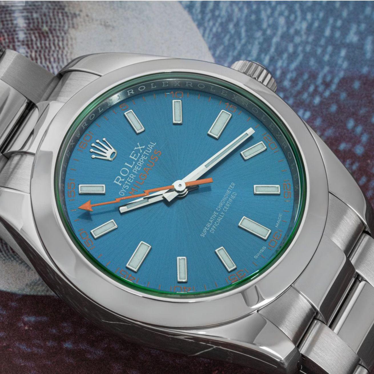 A mens 40mm Milgauss crafted in stainless steel by Rolex. Featuring a distinctive blue dial with an orange second-hand shaped like a lightning bolt and a unique green sapphire crystal which is exclusive to the Rolex Milgauss design.

This piece is