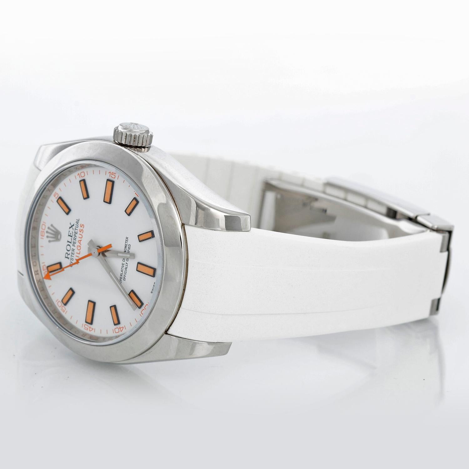Rolex Milgauss Stainless Steel Men's Watch White Dial 116400 - Automatic winding, sapphire crystal, 31 jewels. Stainless steel case with smooth bezel (40mm diameter). White dial with luminous-style orange markers. White Rubber B Strap with with
