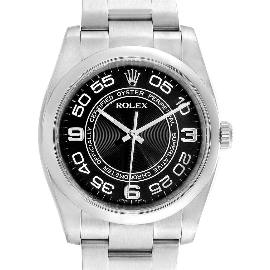 Rolex No Date Mens Black Concentric Dial Stainless Steel Watch 116000. Officially certified chronometer self-winding movement. Stainless steel case 36.0 mm in diameter. Rolex logo on a crown. Stainless steel smooth domed bezel. Black concentric dial