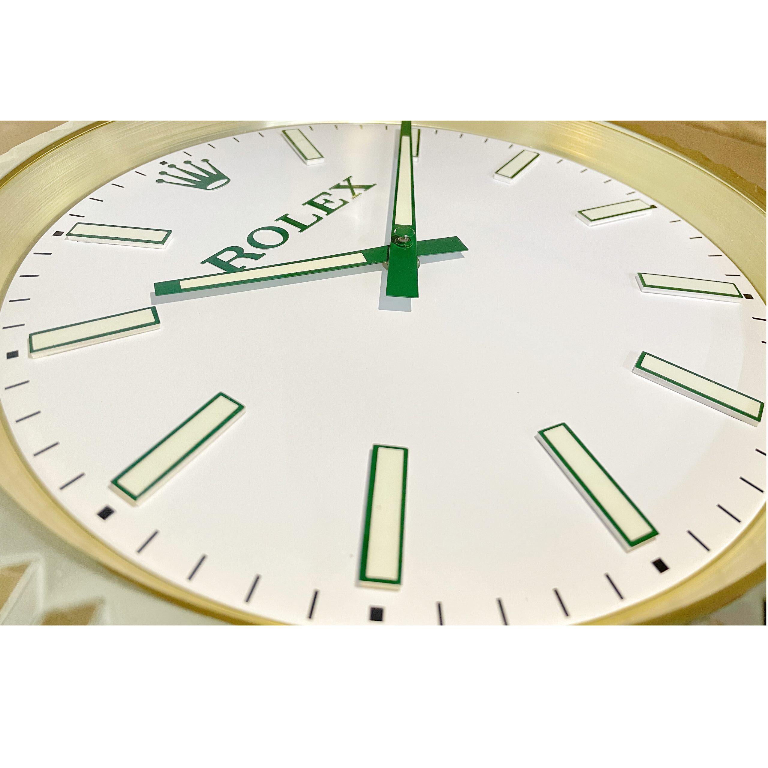 Markers with lume strips. 
Sweeping Quartz movement powered by single AA Battery. 
Clock dimensions measure approximately 34cm by 5cm / 13.5 inch by 2 inch.
Rolex wall clock
Good condition, working.
Free international shipping.