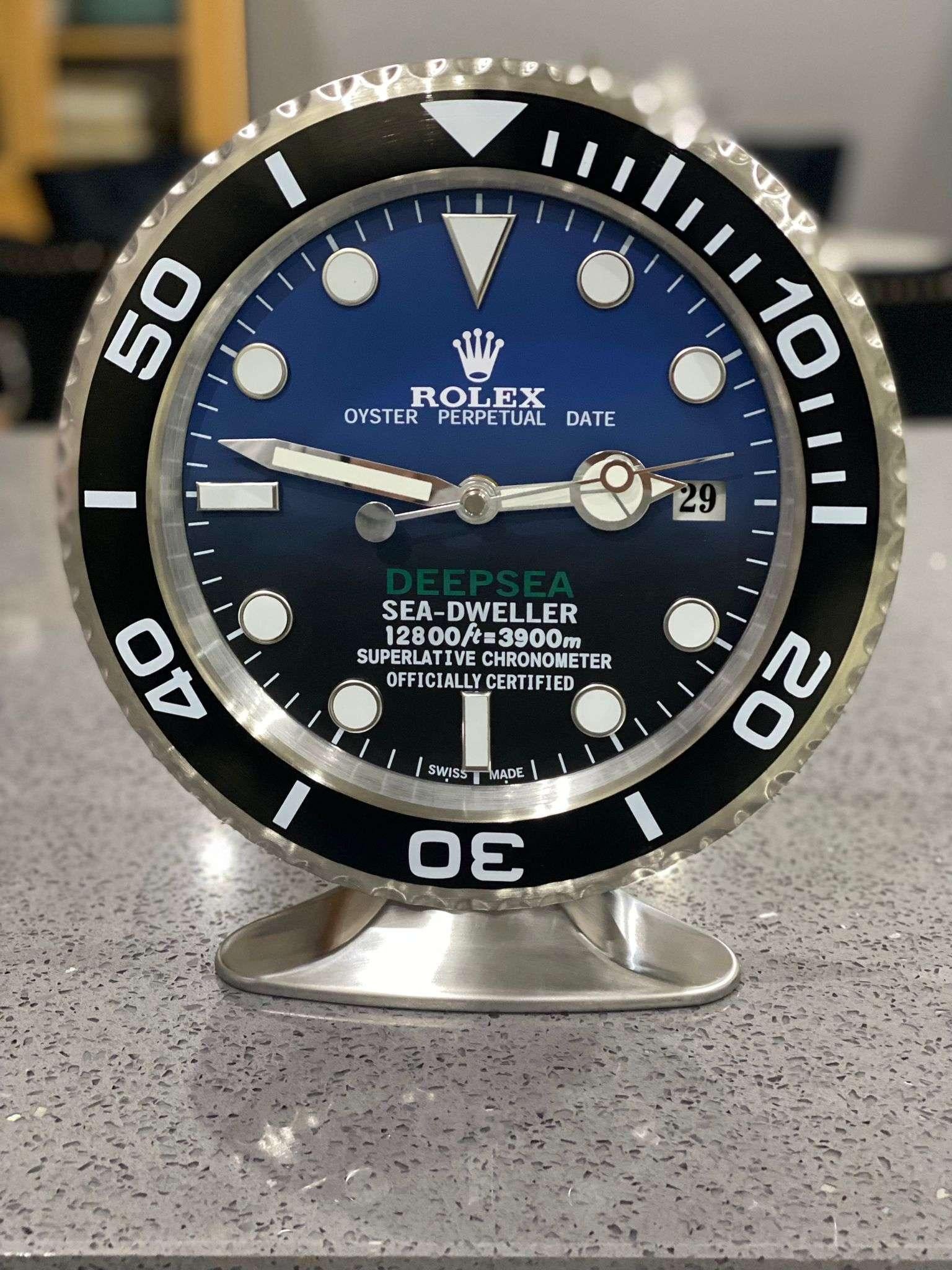 ROLEX Officially Certified Oyster Perpetual Black Deepsea Dweller Desk Clock 
Luminous hands.
Fully functional date.
Sweeping hands.
Quartz movement.
Good condition, working.
Free international shipping.