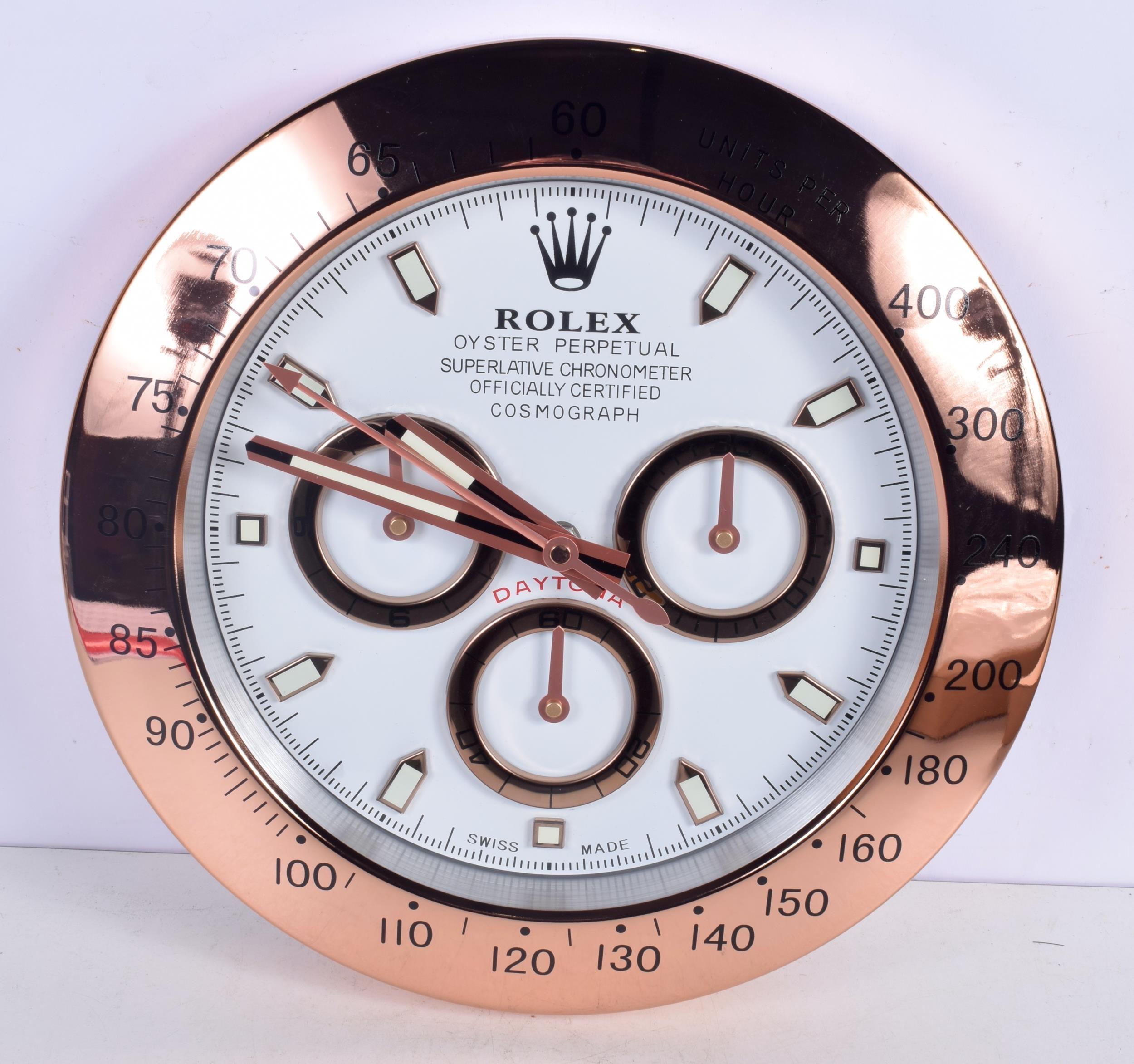 ROLEX Officially Certified Oyster Perpetual Cosmograph Daytona Wall Clock 
Lume strips Sweeping Quartz movement powered by single AA Battery.
Clock dimensions measure approximately 35cm by 5cm thickness
Free international shipping.