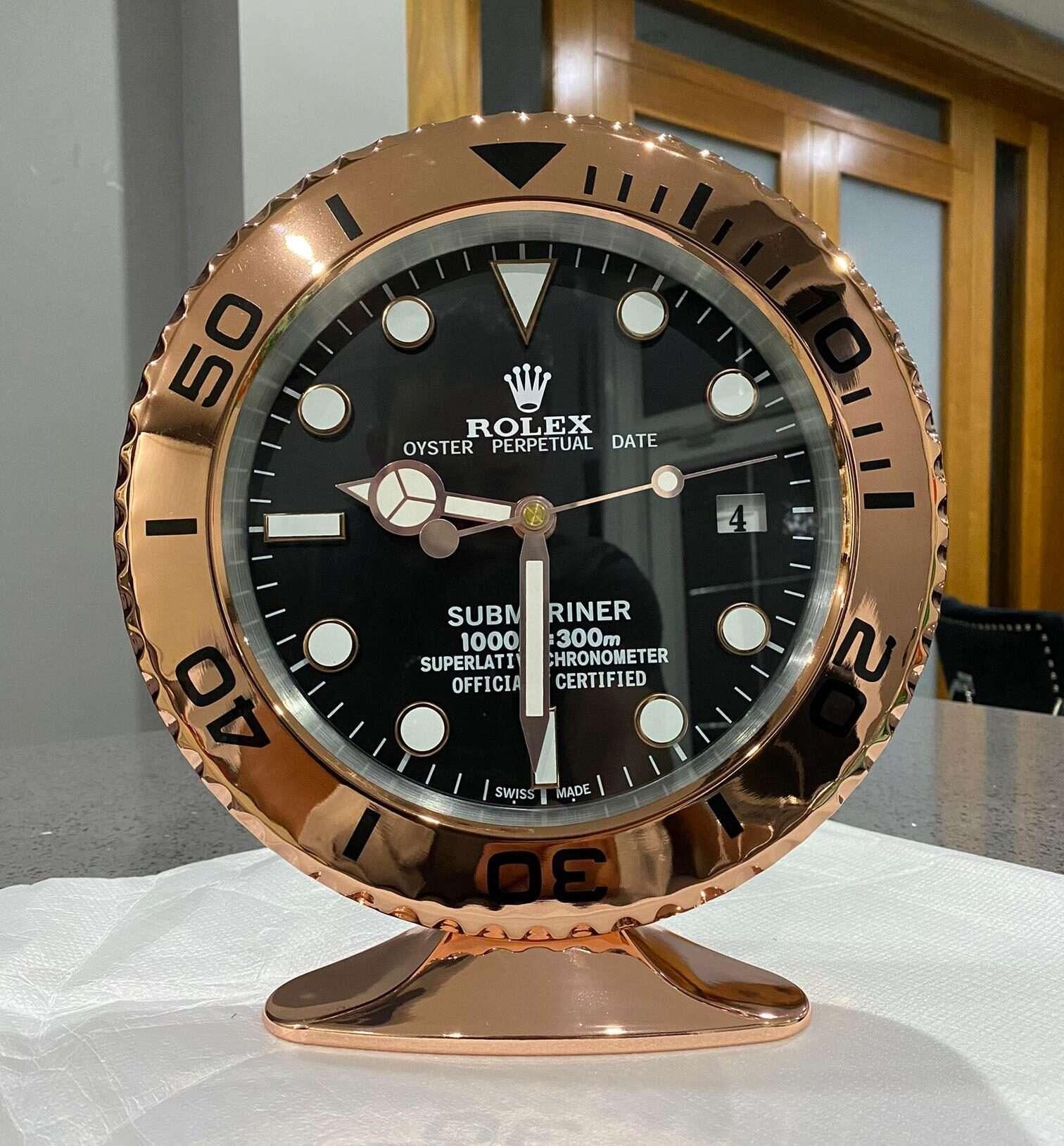 ROLEX Officially Certified Oyster Perpetual Submariner Rose Chrome Desk Clock 
Luminous hands.
Fully functional date.
Sweeping hands.
Quartz movement.
Good condition, working.
Free international shipping.