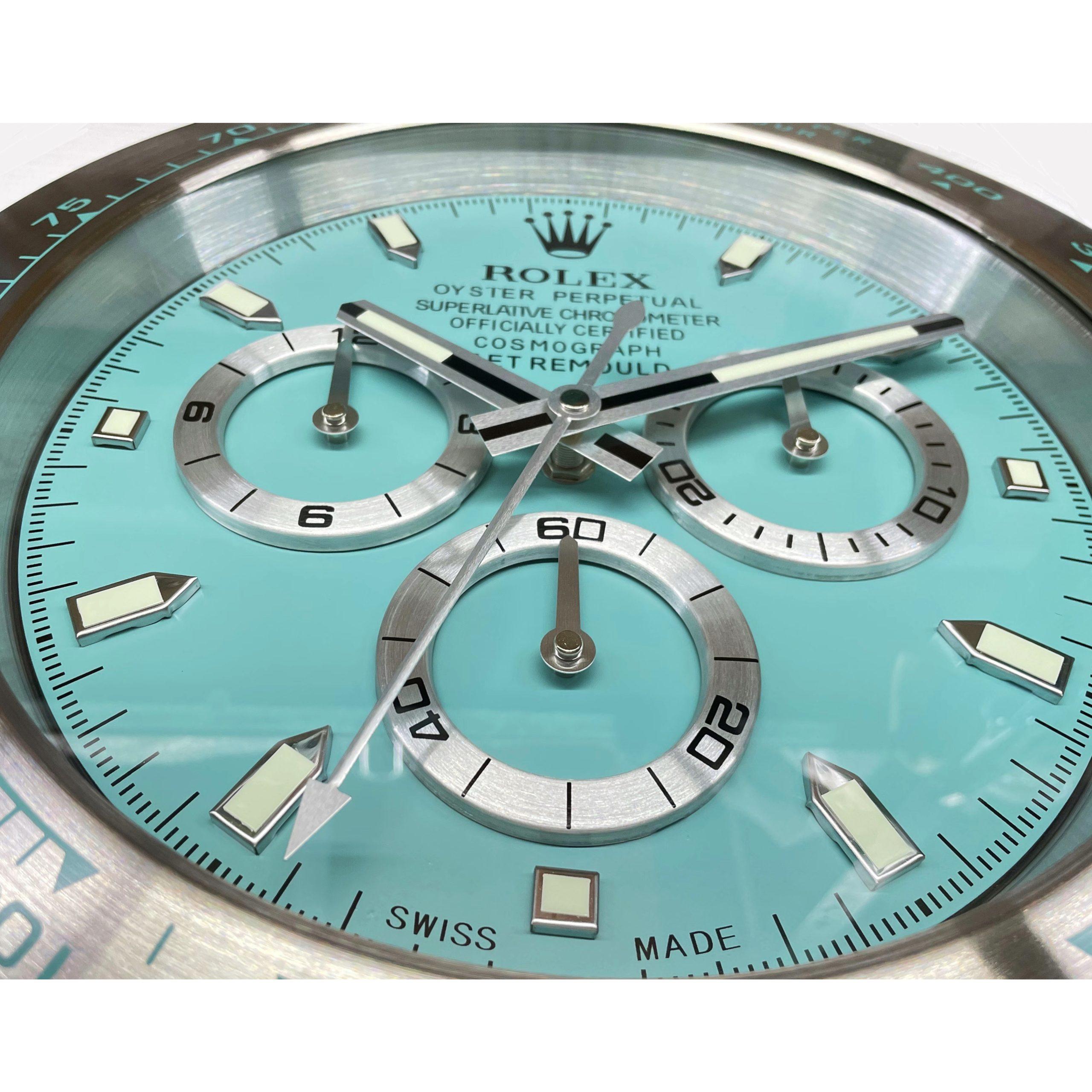 ROLEX Officially Certified Oyster Perpetual Tiffany Blue Daytona Wall Clock 
Good condition, working.
Free international shipping.
Sweeping Quartz movement powered by single AA Battery.
Clock dimensions measure approximately 34cm by 5cm