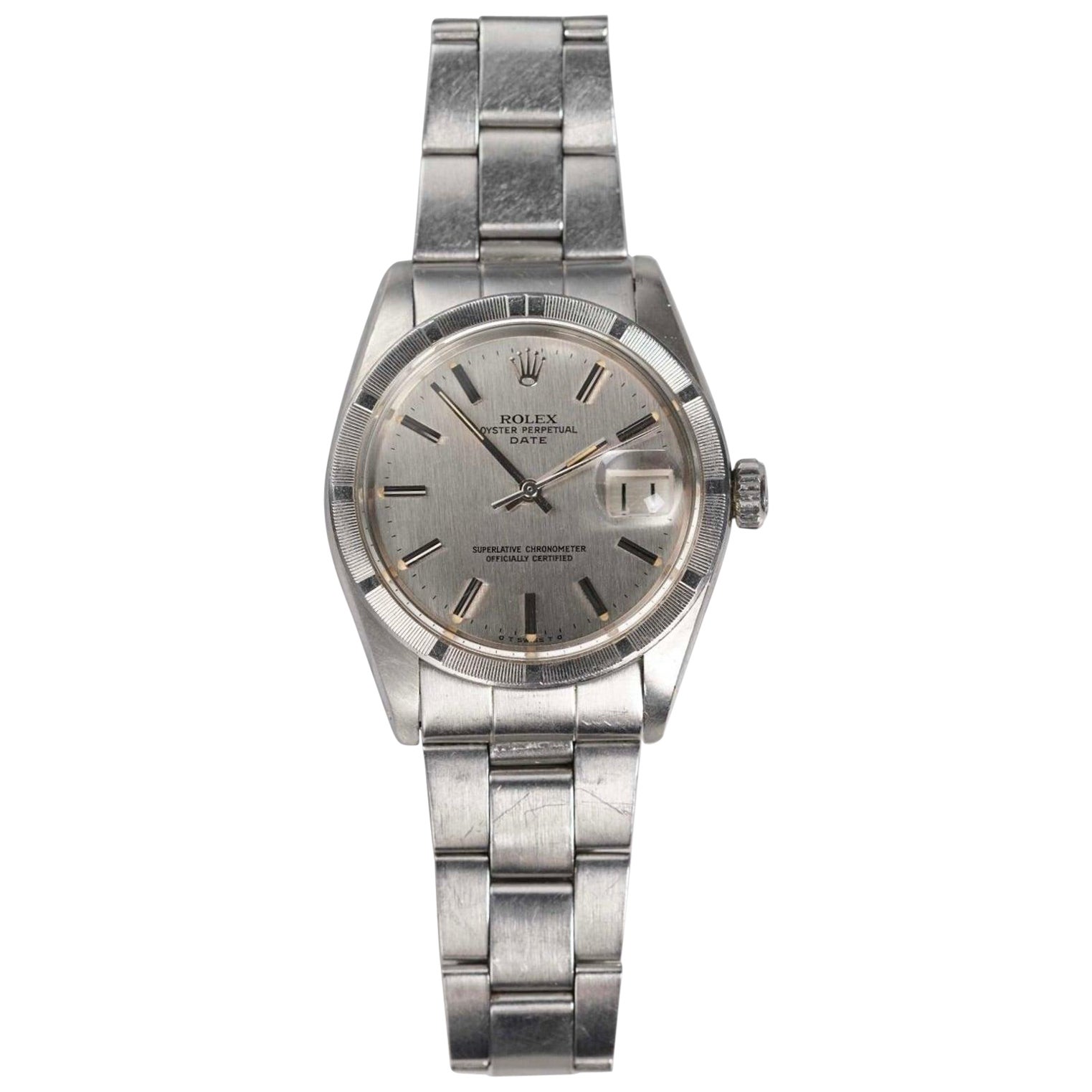 Reloj Rolex OP 1501 de acero inoxidable con esfera de rayas verticales plateadas, años 70