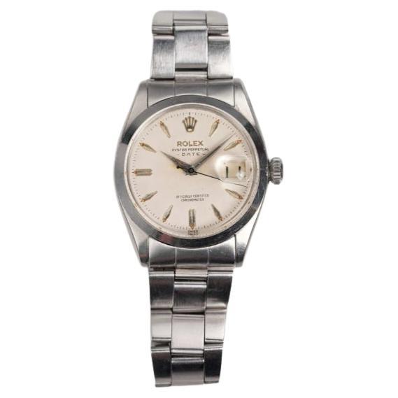Reloj Rolex OP 6534 esfera blanca en caja de acero inoxidable, años 50