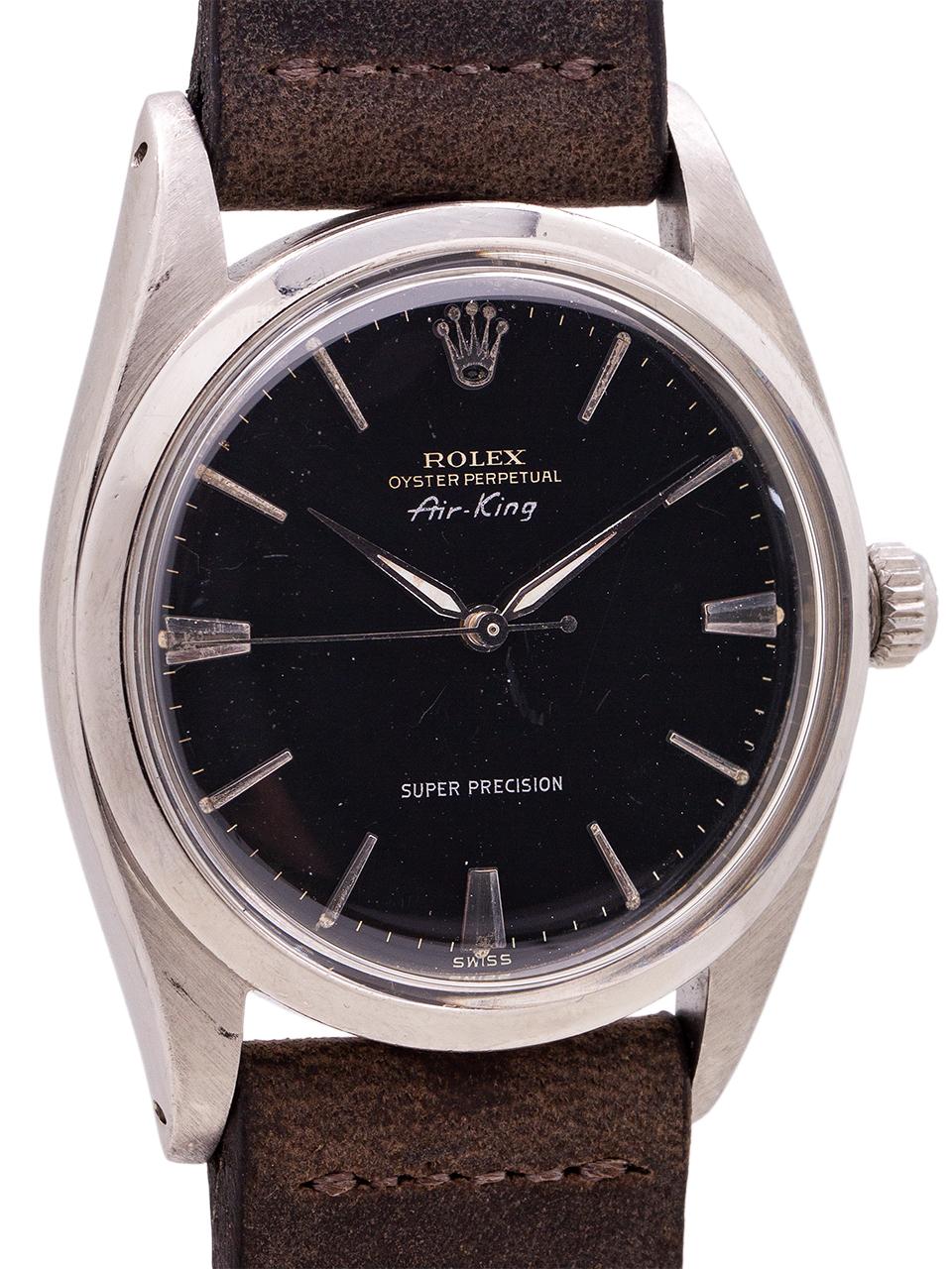 
A terrific looking gilt dial Rolex Air King ref 5504 serial# 452,xxx circa 1959. Featuring a 36mm diameter stainless steel case with smooth bezel, with a beautiful original gloss black, gilt dial with applied silver indexes and tapered silver, lume
