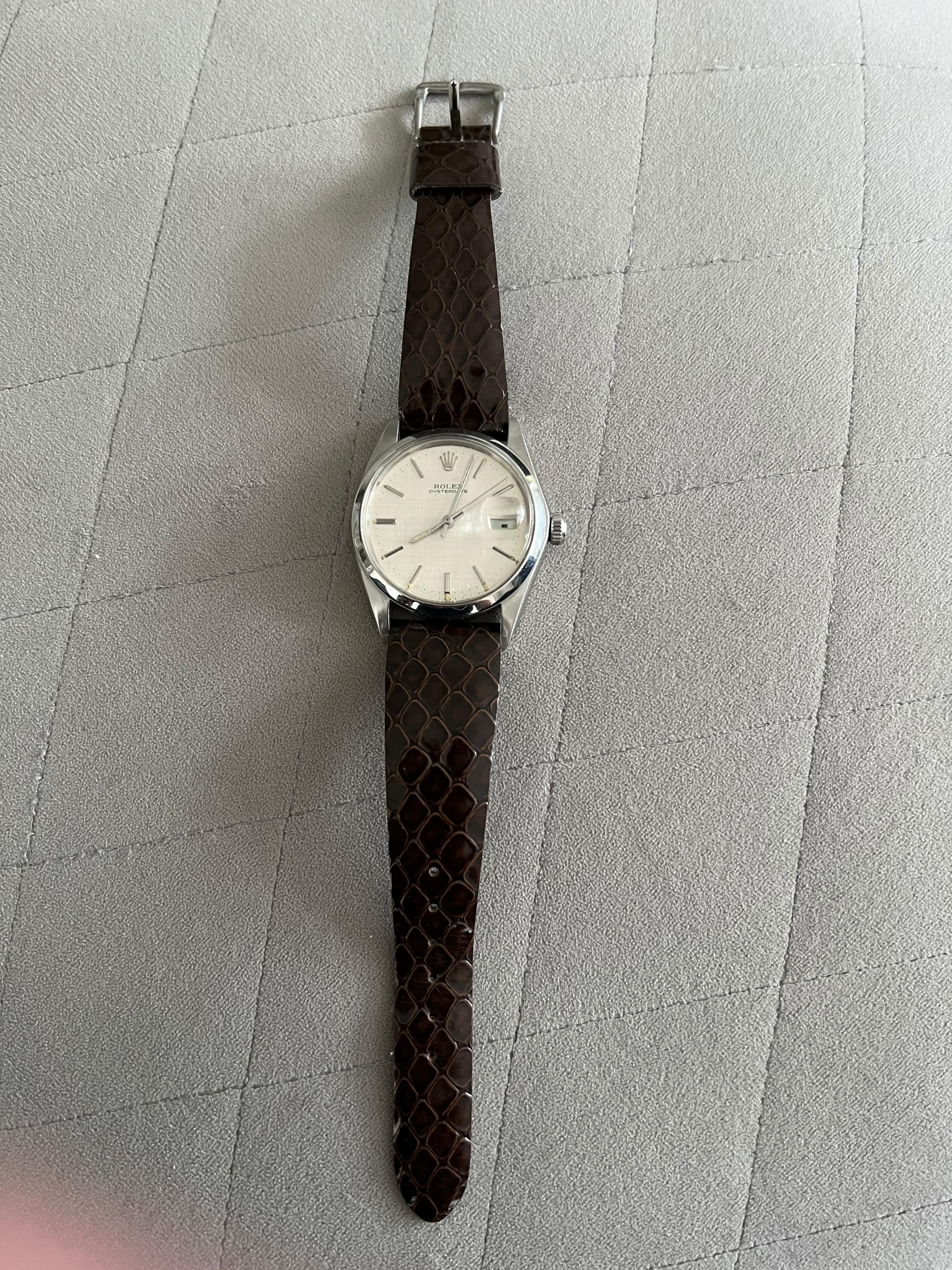 Mens Rolex Oyster-date Precision Hand-Wind 1970s Vintage In mint condition. 
Chocolate vintage lather strap. 
Rare clean face 
White clean dial as good a new
Simple, clean classic and chic
Luminous 
In perfect working condition 
Comes with a green