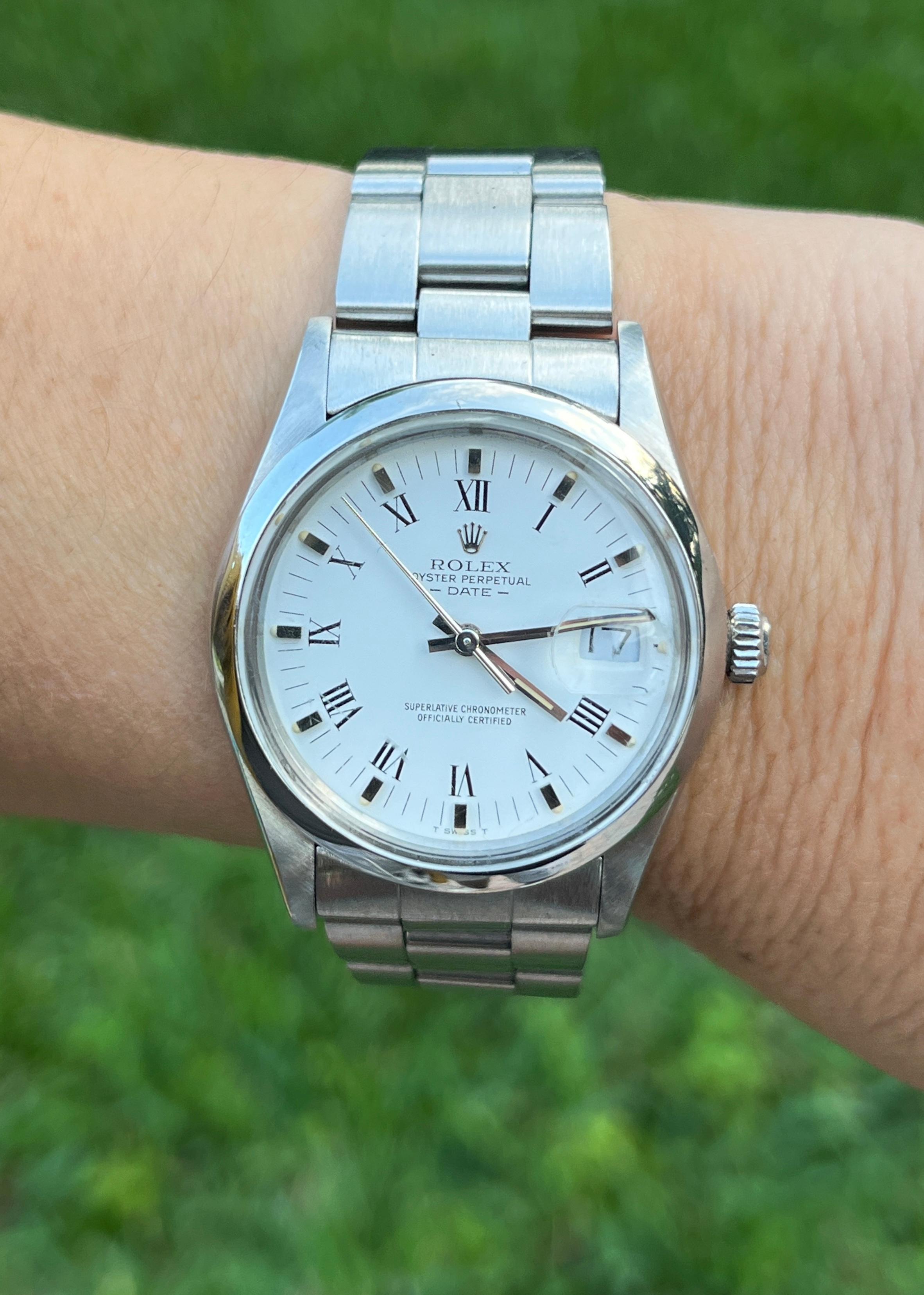 Rolex Oyster Perpetual Date wristwatch in stainless steel. Features an Oyster bracelet, fold-over clasp (deployment release), quickset, and sapphire crystal. Screw-down crown, and 27 jewels with date bubble. Crisp white dial with silver and Roman