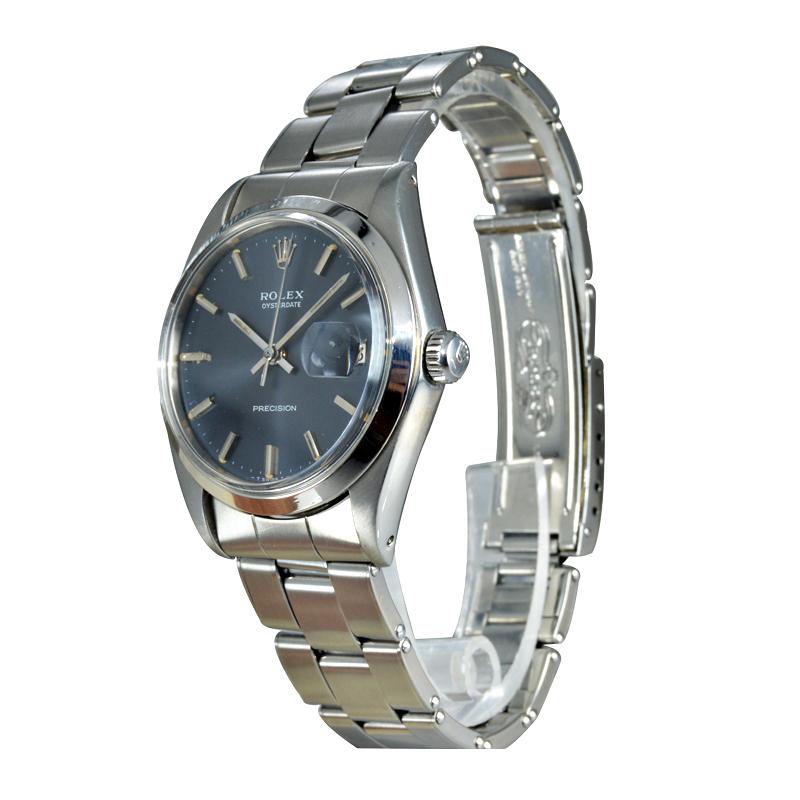 FACTORY / HOUSE: Rolex Watch Company
STYLE / REFERENCE: Oyster with Date / Ref. 6694
METAL / MATERIAL: Stainless Steel 
CIRCA / YEAR:  1970 / 1971
DIMENSIONS / SIZE: 42mm X 34mm
MOVEMENT / CALIBER: Manual Winding / 17 Jewels / Cal. 1220
DIAL /