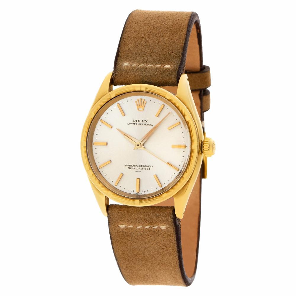 Rolex Oyster Perpetual in 14k on suede leather strap with 14k tang buckle. Automatic w/ sweep seconds. 33 mm case size. Ref 1007. Circa 1952 Fine Pre-owned Rolex Watch. Certified preowned Classic Rolex Oyster Perpetual 1007 watch is made out of