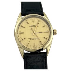 Rolex Oyster Perpetual 1024 Oro Amarillo Acero Champán Esfera Correa de piel