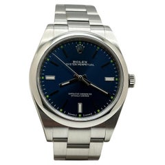 Rolex Oyster Perpetual 114300 39mm Blaues Zifferblatt Edelstahl Box Papier