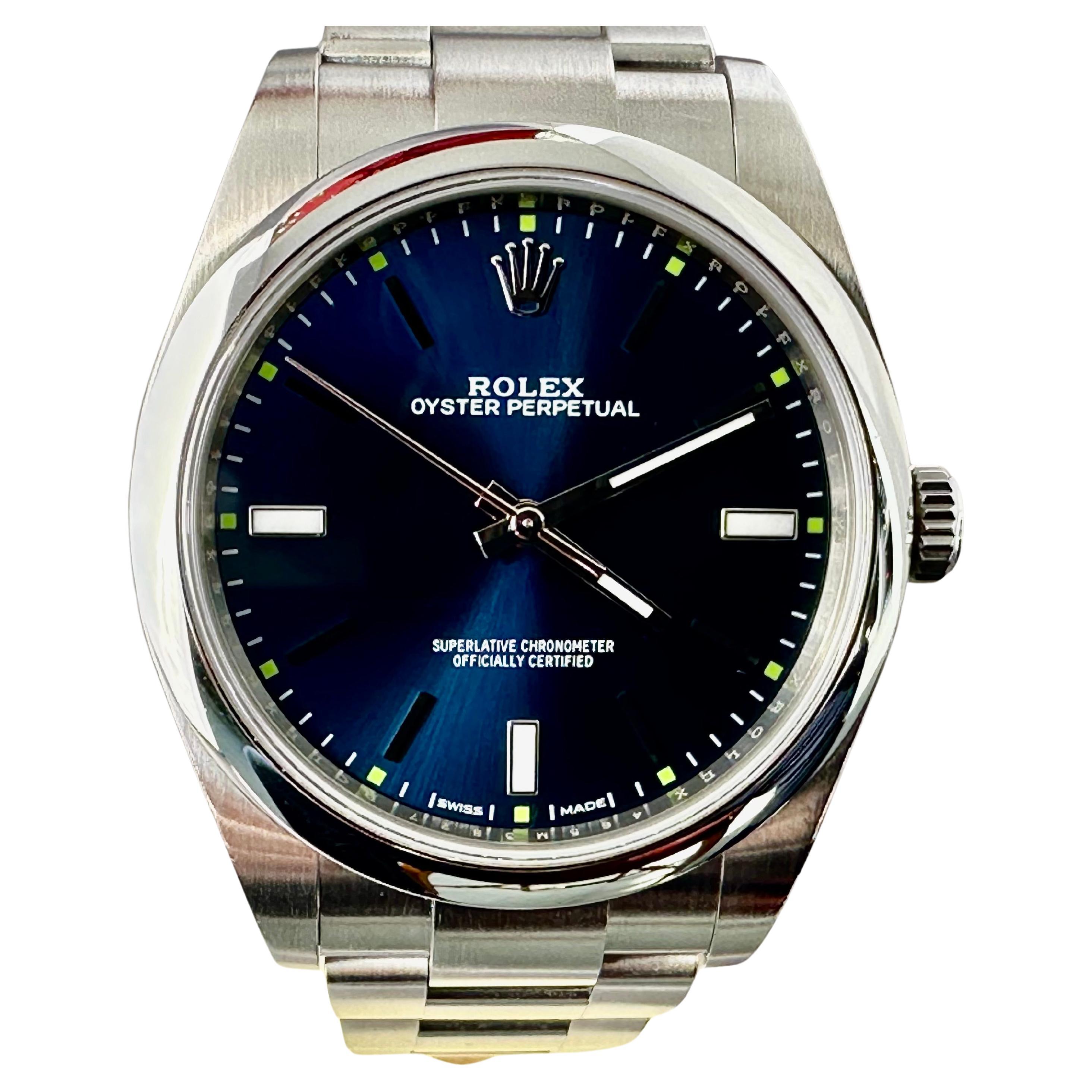 Rolex Oyster Perpetual #114300 39mm Stainless Steel w/ Blue Dial For Sale