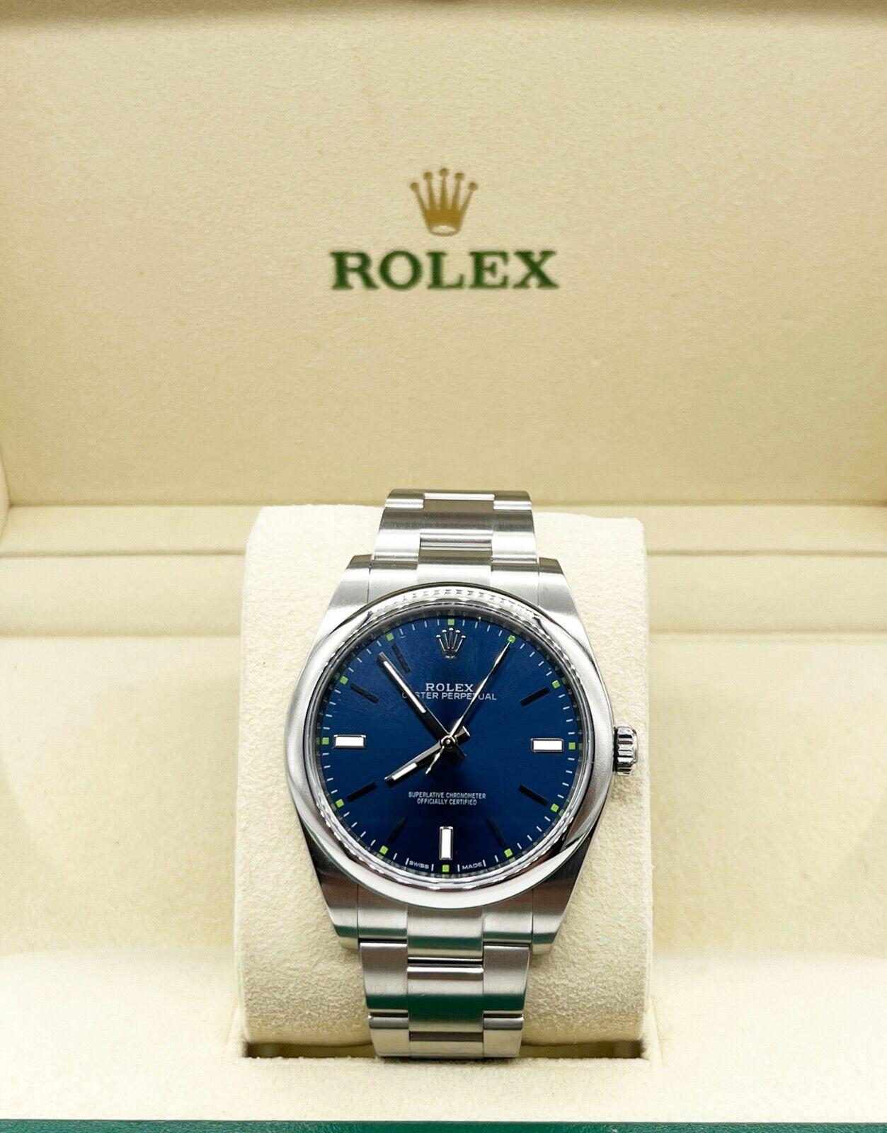 Rolex Oyster Perpetual 114300 Blaues Zifferblatt Edelstahl Box 39mm Herren
