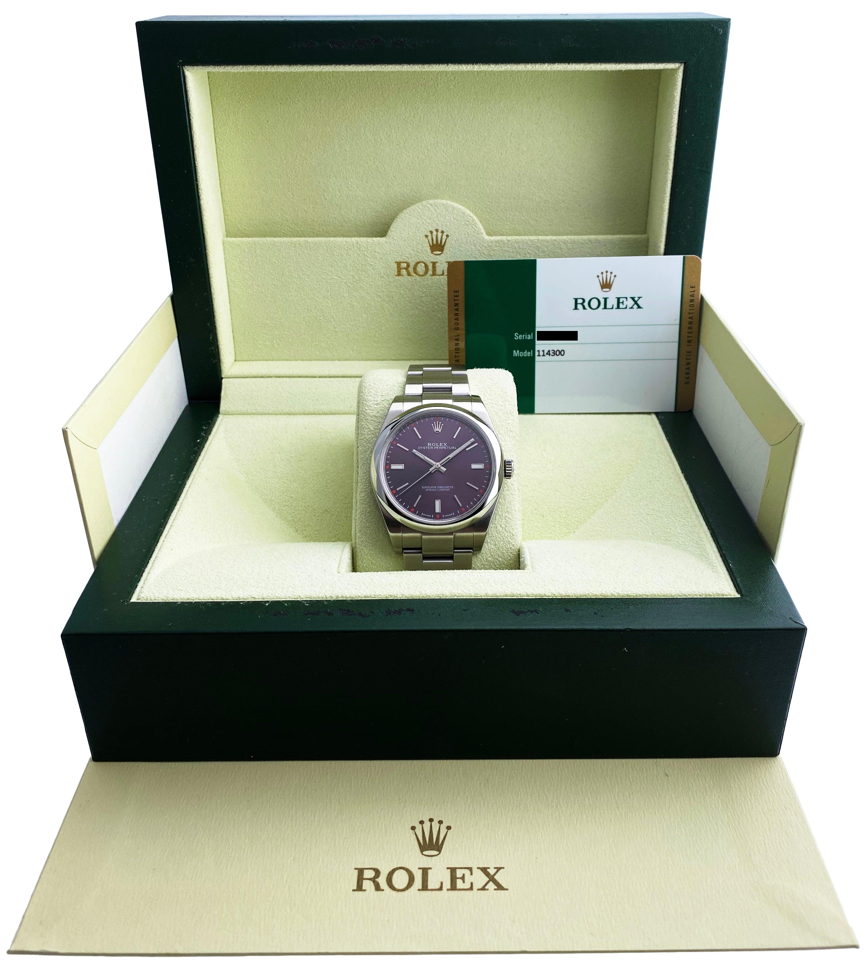 
 Rolex Oyster Perpetual 114300 Mens Watch. 39mm stainless steel case with smooth stainless steel bezel. Red grape dial with steel hands and index hour markers. Stainless steel Oyster bracelet with fold over clasp. Will fit up to a 7-inch wrist.