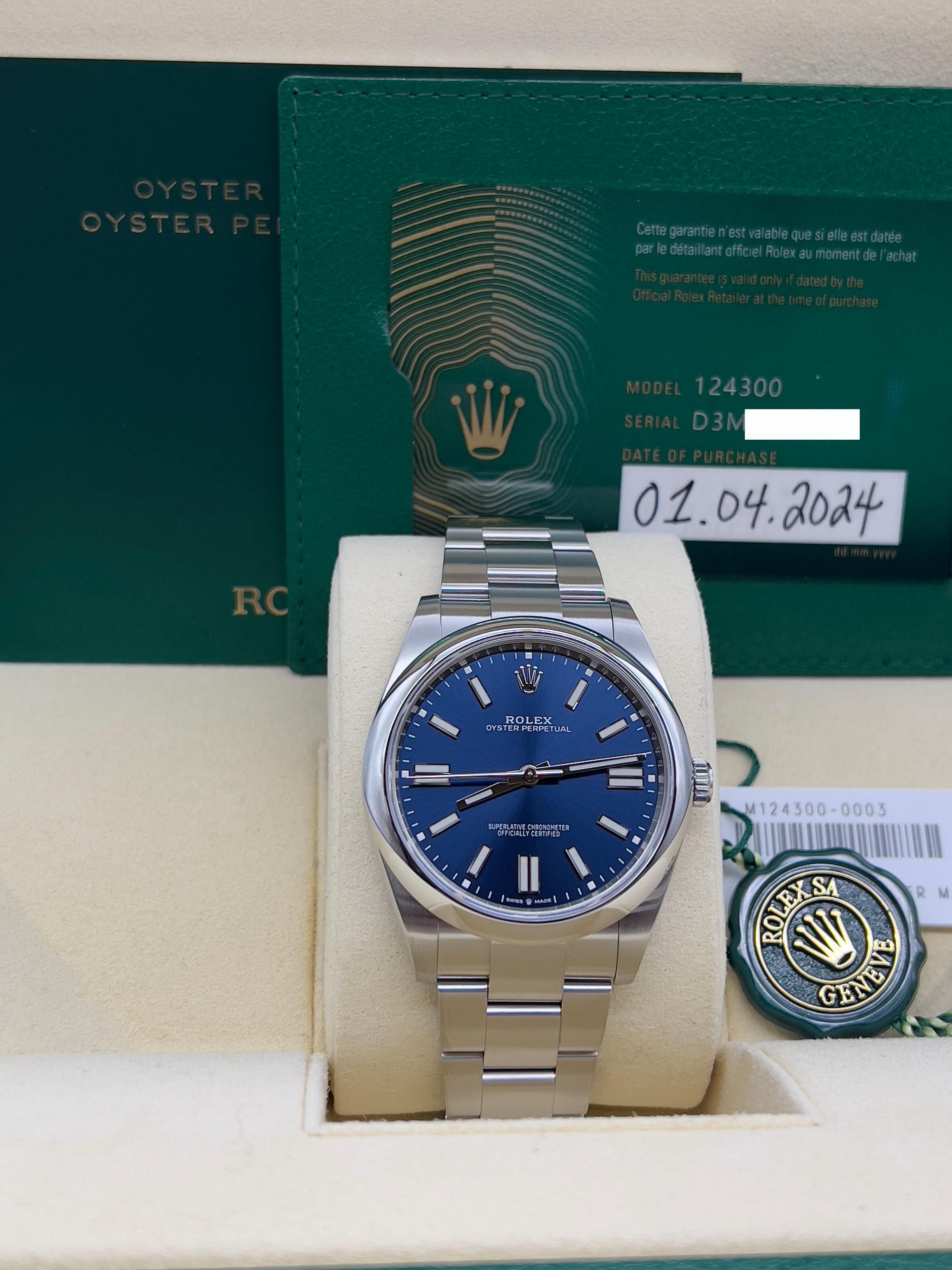 Style Number: 124300
Serial: D3M97***
Year: 2024
Model: Rolex Oytser Perpetual 
Case Material: Stainless Steel 
Band: Stainless Steel 
Bezel: Stainless Steel 
Dial: Blue Dial 
Face: Sapphire Crystal 
Case Size: 41mm
Includes: 
-Rolex Box &