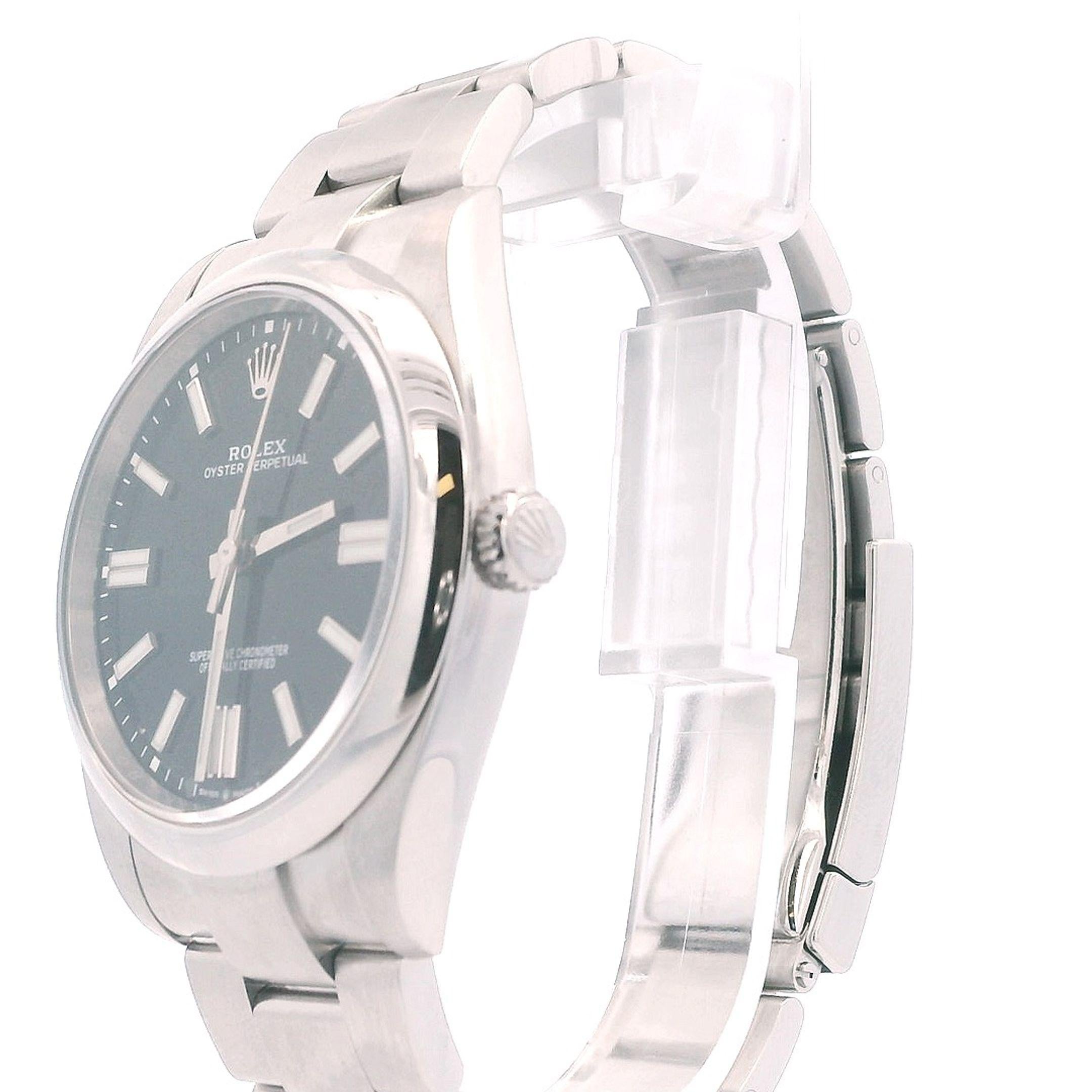 Rolex Oyster Perpetual 124300 Mens Watch. 41mm stainless steel case with smooth bezel. Black dial with luminous steel hands and index hour marker. Minute marker around the outer dial. Stainless steel oyster bracelet with stainless steel fold over