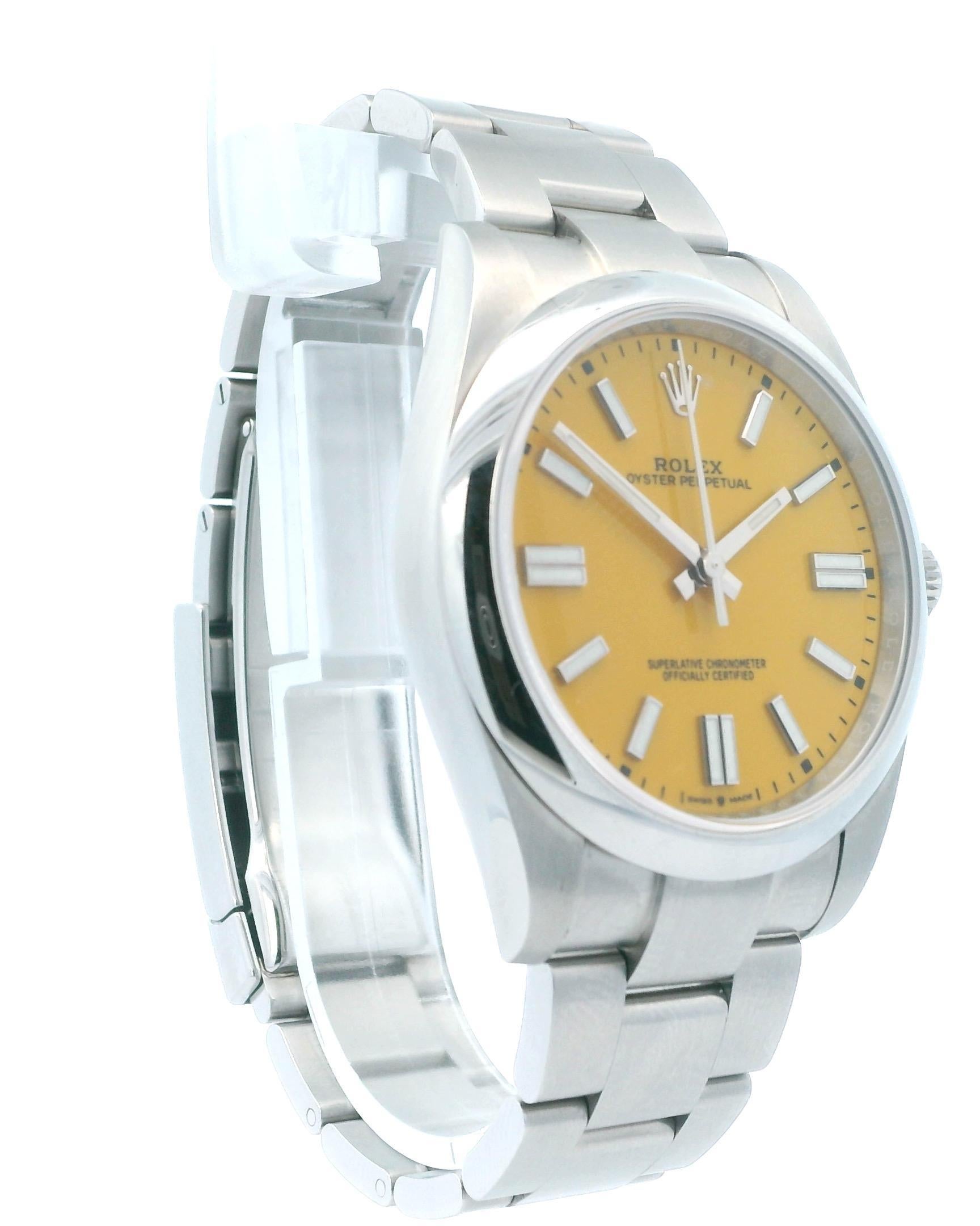 Rolex Oyster Perpetual 124300 Mens Watch. 41mm stainless steel case with smooth bezel. Yellow dial with luminous steel hands and index hour marker. Minute marker around the outer dial. Stainless steel Oyster bracelet with stainless steel fold over