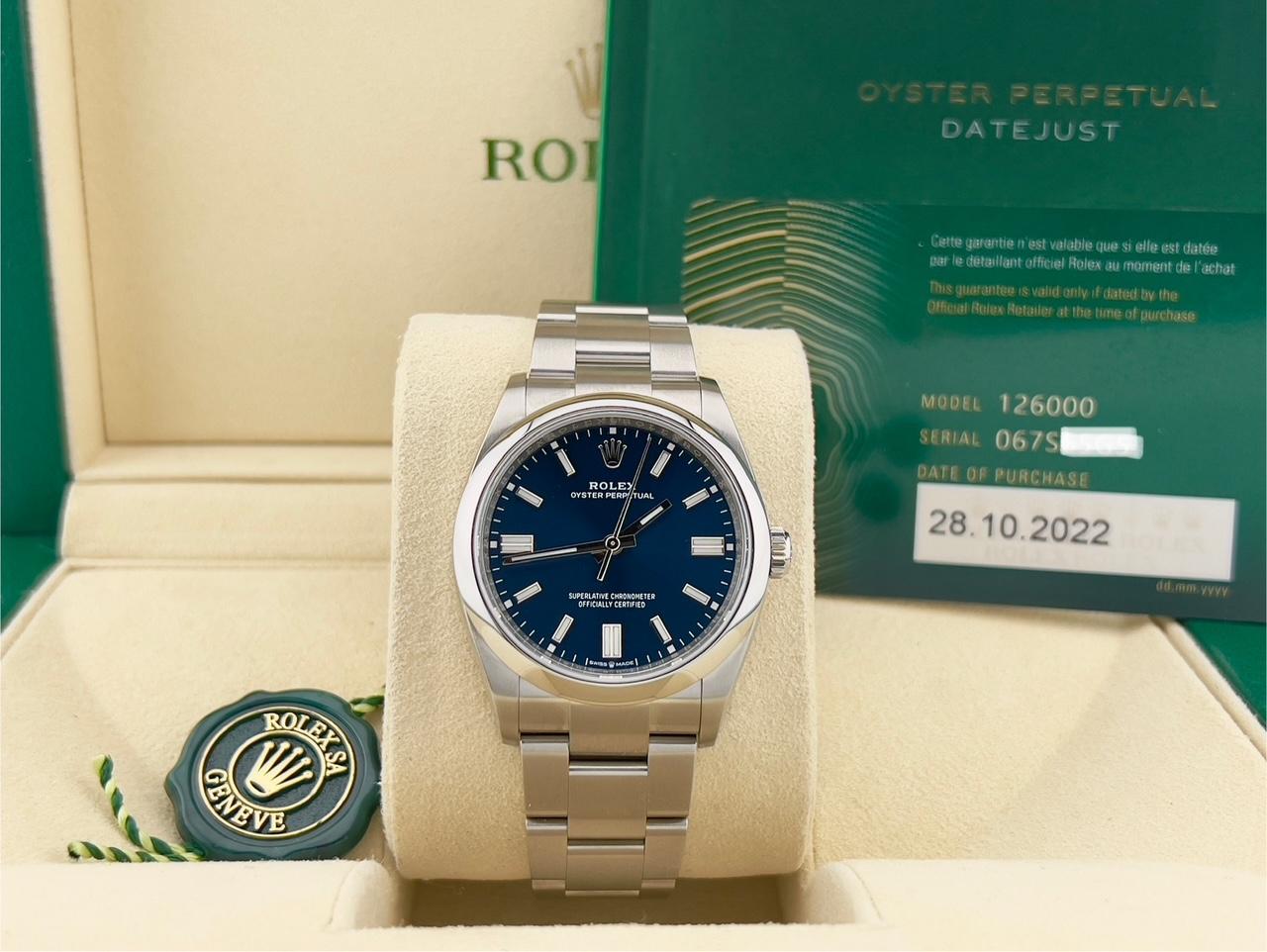 Style Number: 126000

Serial: 067S6***

Year: 2022

Model: Rolex Oyster Perpetual 

Case Material: Stainless Steel 

Band: Stainless Steel 

Bezel: Stainless Steel  

Dial: Blue Dial 

Face: Sapphire Crystal 

Case Size: 36mm 

 
Includes: 

-Rolex