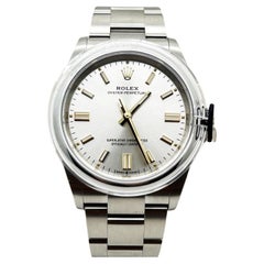 Rolex Oyster Perpetual 126000 Silber Zifferblatt Edelstahl Box Papier 2021