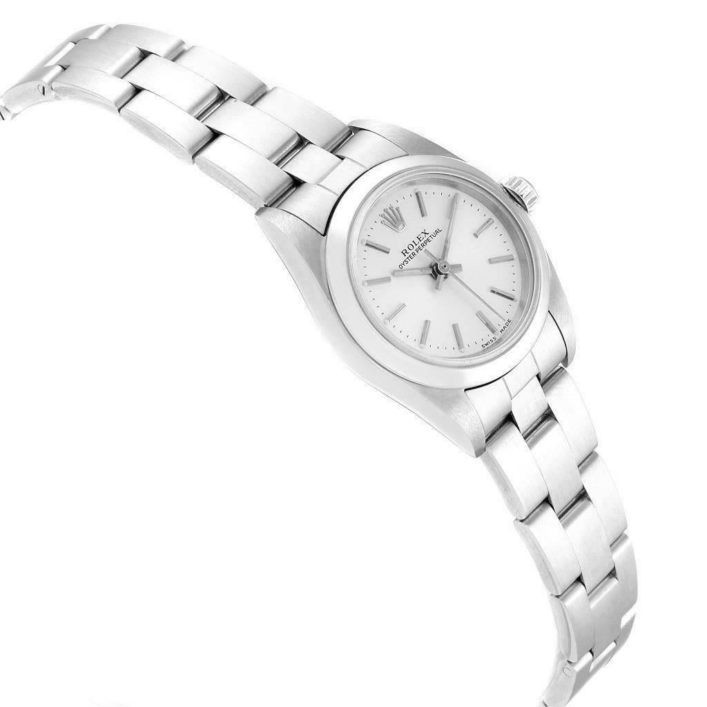 Rolex Oyster Perpetual 24 Nondate Silver Dial Ladies Watch 76080 Papers. Officially certified chronometer self-winding movement. Stainless steel oyster case 24 mm in diameter. Rolex logo on a crown. Stainless steel smooth domed bezel. Scratch