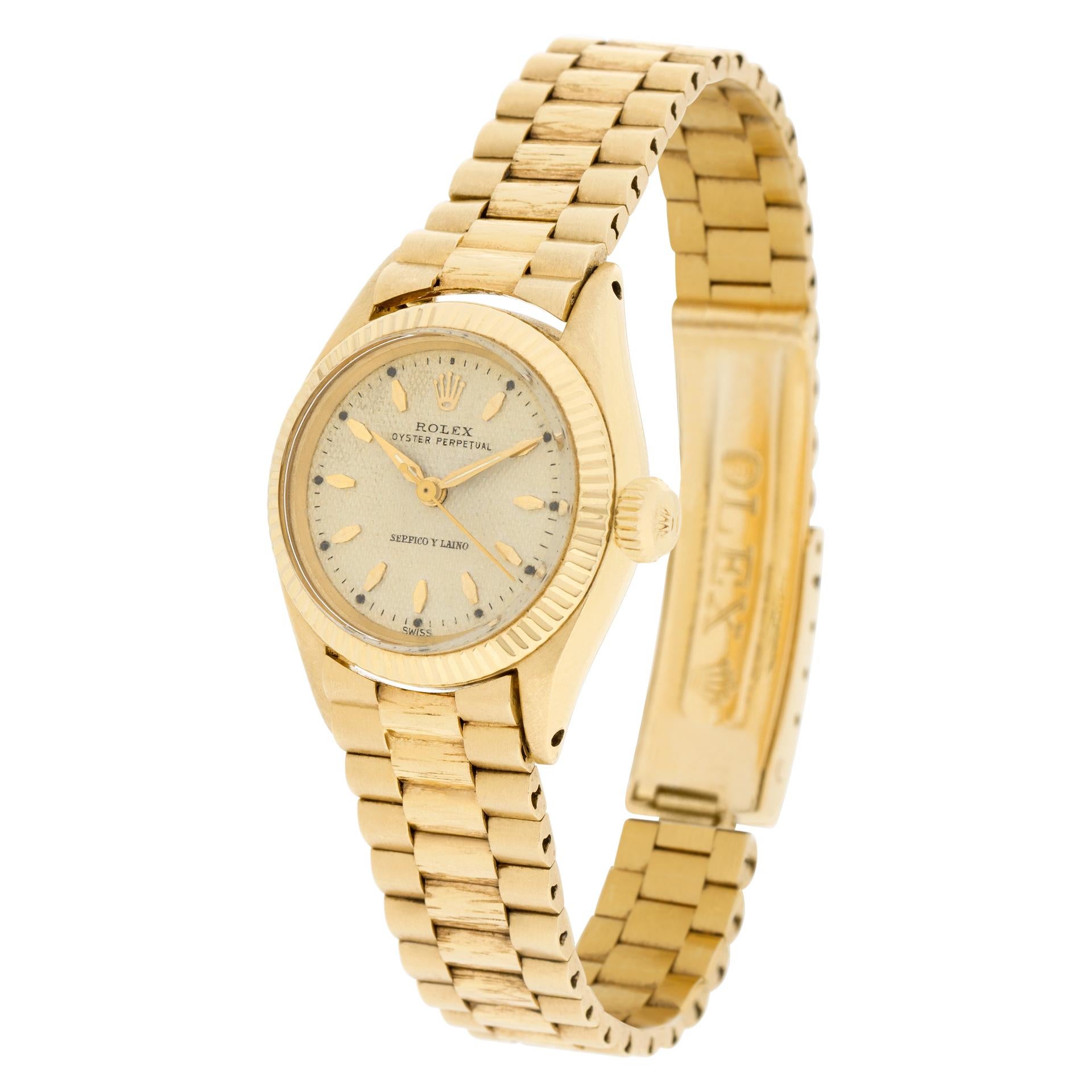 Vintage Rolex Oyster Perpetual in 18k yellow gold on a DA Venezuela Rolex authorized bark finish president bracelet. Automatic. Circa 1960. 25 mm case size. Ref 6619. Fine Pre-owned Rolex Watch. Certified preowned Vintage Rolex Oyster Perpetual 6619