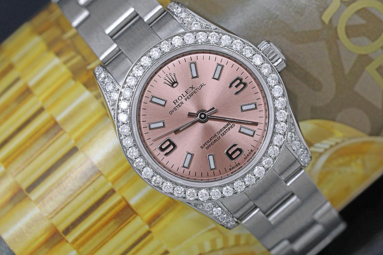 Rolex Oyster Perpetual 26mm Stainless Steel Ladies Watch with Diamonds Pink Salmon Dial 176200

This watch is in like new condition. It has been polished, serviced and has no visible scratches or blemishes. All our watches come with a standard 1
