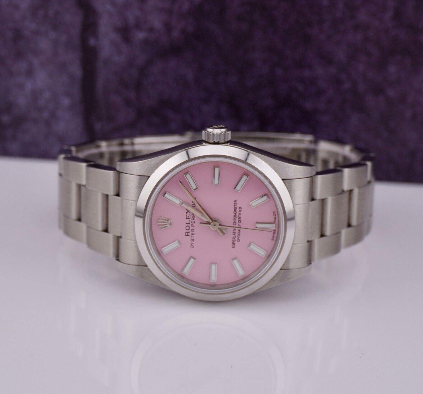 Rolex Oyster Perpetual 31mm Watch

Pre-owned W/Gift Box 
100% Authentic Authenticity Card
Condition - (Great Condition) - See Pics
Watch Reference - 77080
Model - Oyster Perpetual 
Dial Color - Pink
Material - Stainless Steel
Watch Will Fit Wrist