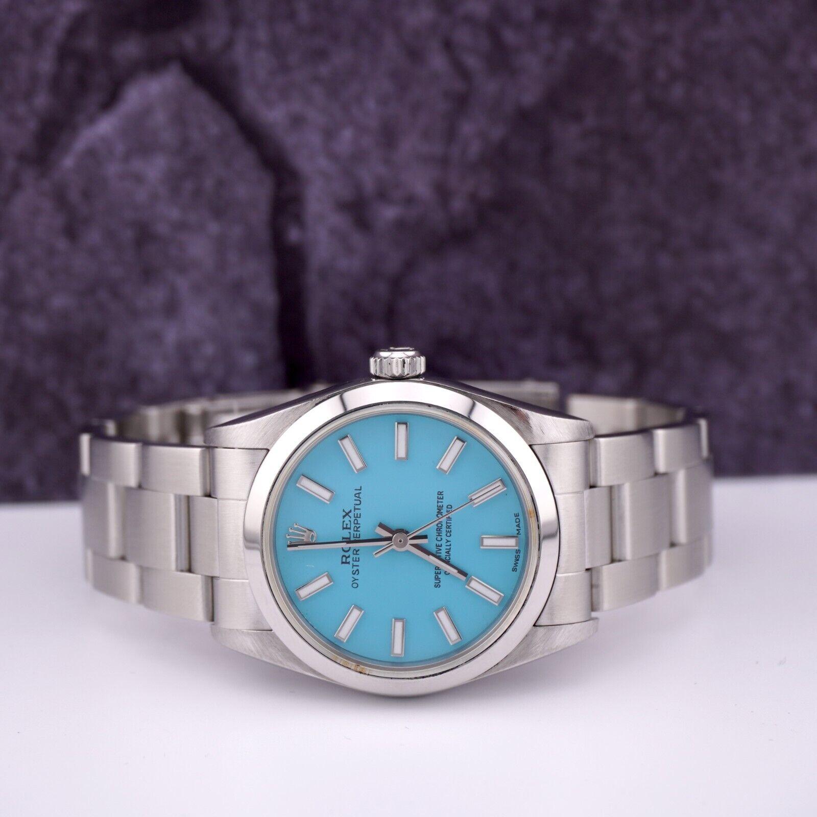 Rolex Oyster Perpetual 31mm Watch

Pre-owned w/ Gift Box
100% Authentic Authenticity Card
Condition - (Great Condition) - See Pics
Watch Reference - 77080
Model - Oyster Perpetual
Dial Color - Tiffany Blue
Material - Stainless Steel
Watch Will Fit