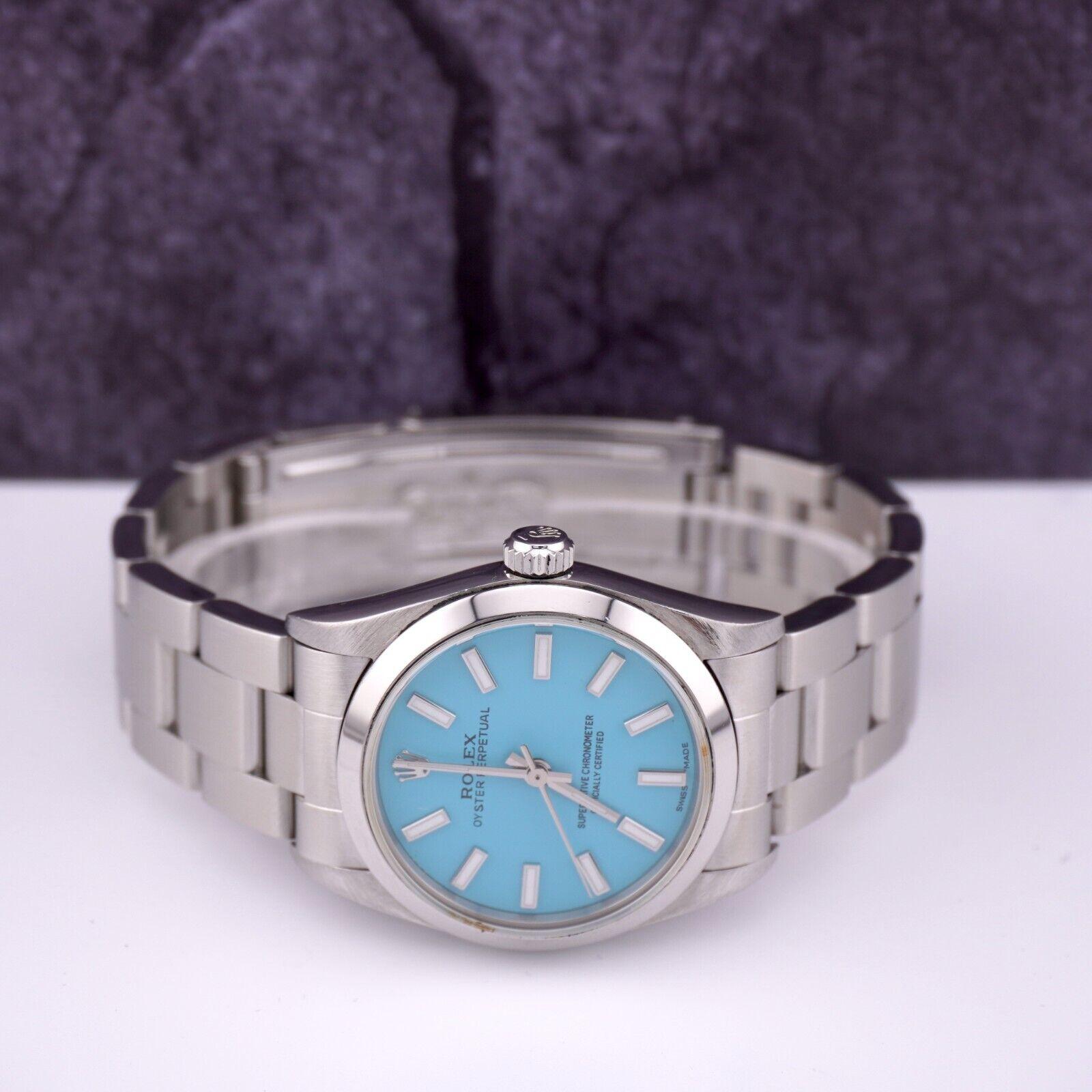 Reloj Rolex Oyster Perpetual 31mm Acero inoxidable Esfera Azul Tiffany Ref 77080 en venta 4