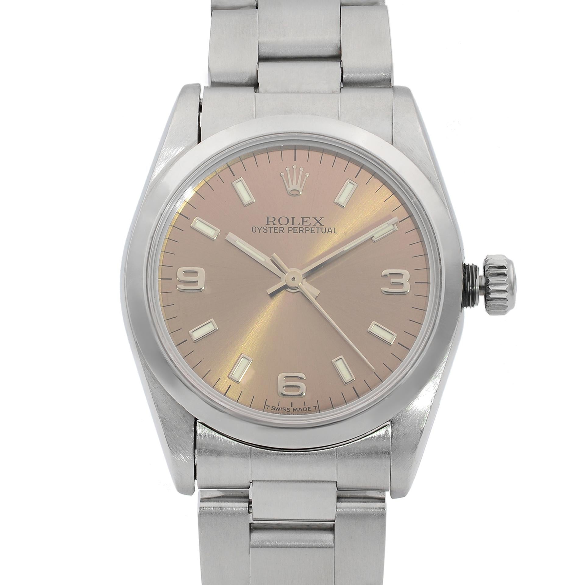 This pre-owned Rolex Oyster Perpetual 67480 is a beautiful Ladie's timepiece that is powered by mechanical (automatic) movement which is cased in a stainless steel case. It has a round shape face,  dial and has hand sticks & numerals style markers.