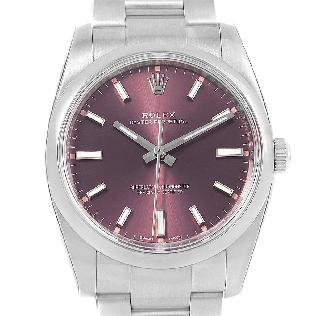 Rolex Oyster Perpetual 34 Red Grape Dial Steel Mens Watch 114200 Unworn. Officially certified chronometer self-winding movement. Stainless steel case 34 mm in diameter. Rolex logo on a crown. Stainless steel smooth domed bezel. Scratch resistant