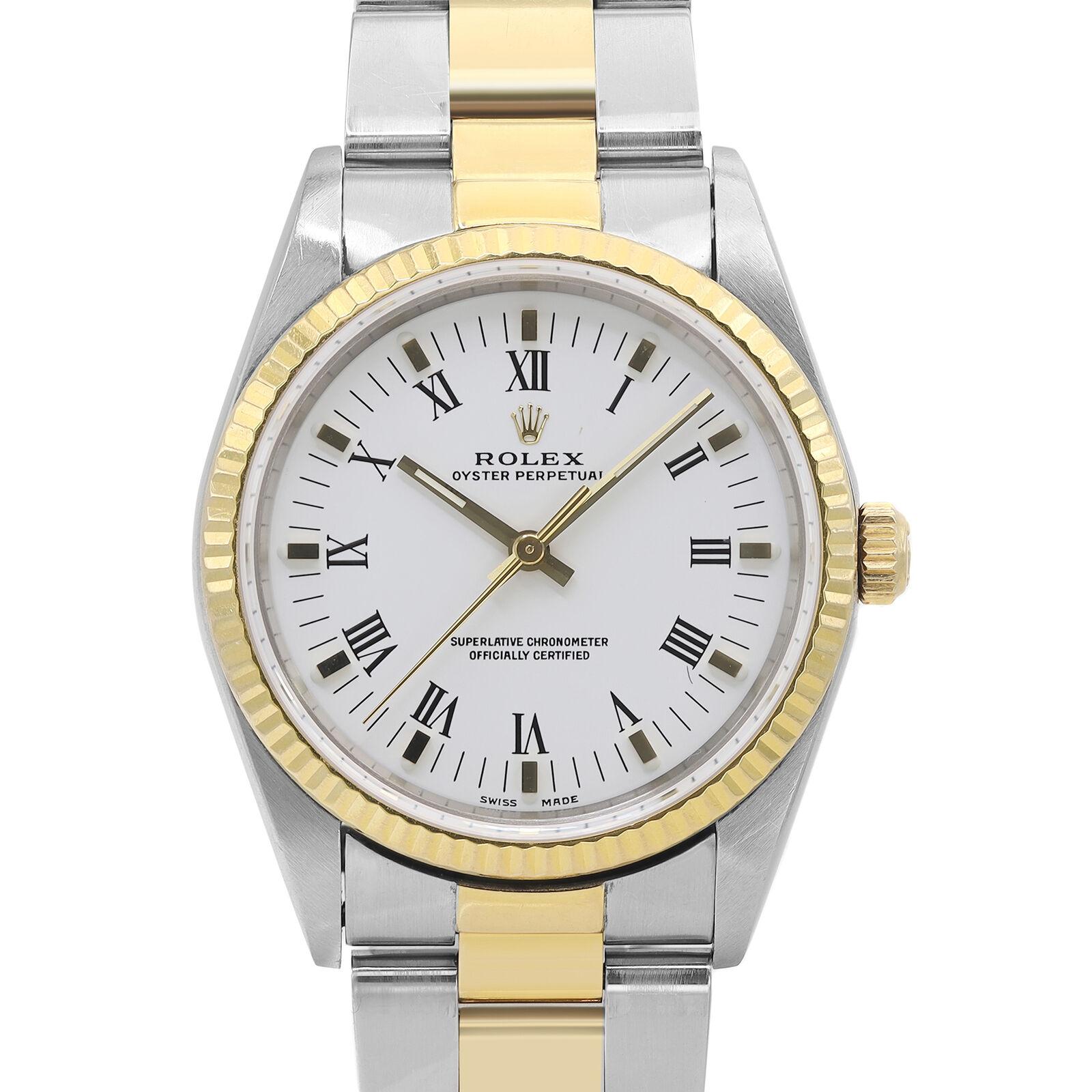 Pre-owned Rolex Oyster Perpetual 34mm 18K Yellow Gold & Steel Automatic Men Watch 14233. This watch was produced in 1994. This beautiful men's timepiece is powered by an automatic movement which is cased in a stainless steel case. It has a round