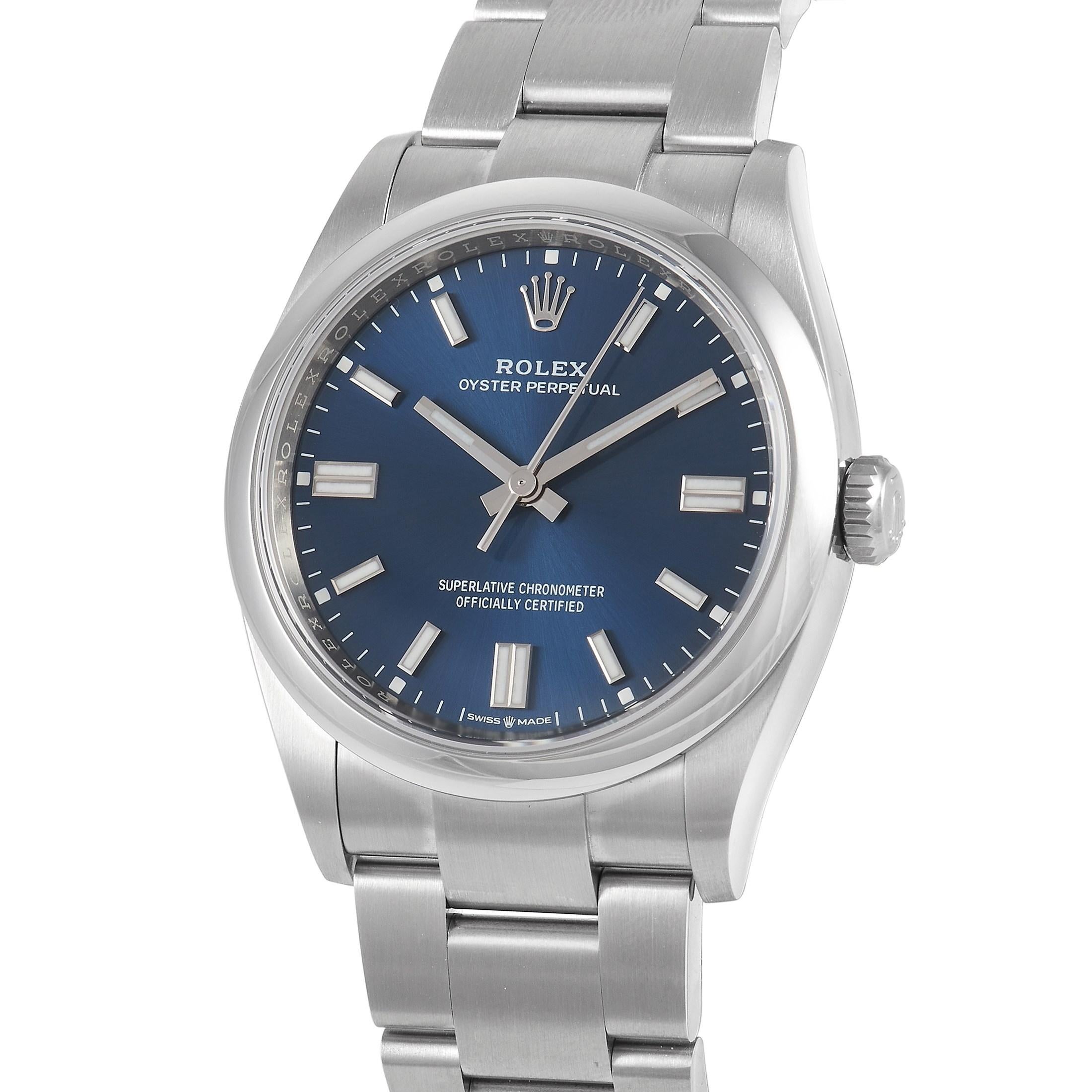 Launched in 2020, the Rolex Oyster Perpetual 36 Blue Dial Watch 126000 is a true understated classic. It features a versatile and more wearable 36mm case and a dramatic bright blue dial with a sunburst finish. On the dial are luminescent 18K white