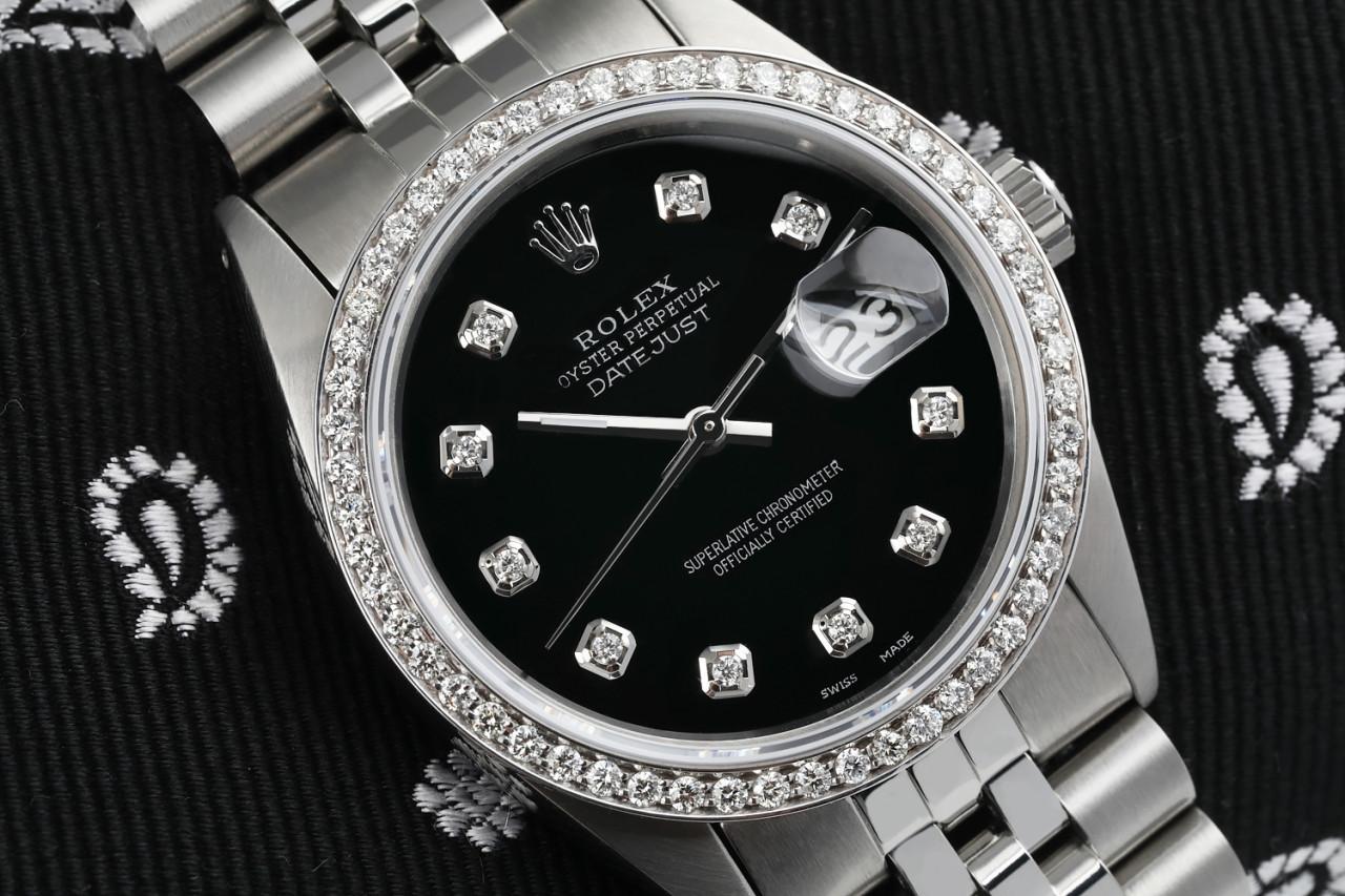 Rolex Oyster Perpetual 36mm Datejust Black Dial with Diamond Numbers & Bezel 16014 Watch.
This watch is in like new condition. It has been polished, serviced and has no visible scratches or blemishes. All our watches come with a standard 1 year