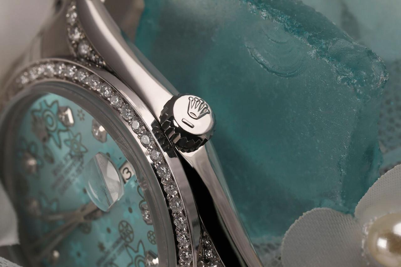 Rolex Datejust 36mm Custom Ice Blue Flower Diamond Dial, Diamond Bezel and Diamond Lugs 16014

This watch is in like new condition. It has been polished, serviced and has no visible scratches or blemishes. All our watches come with a standard 1 year