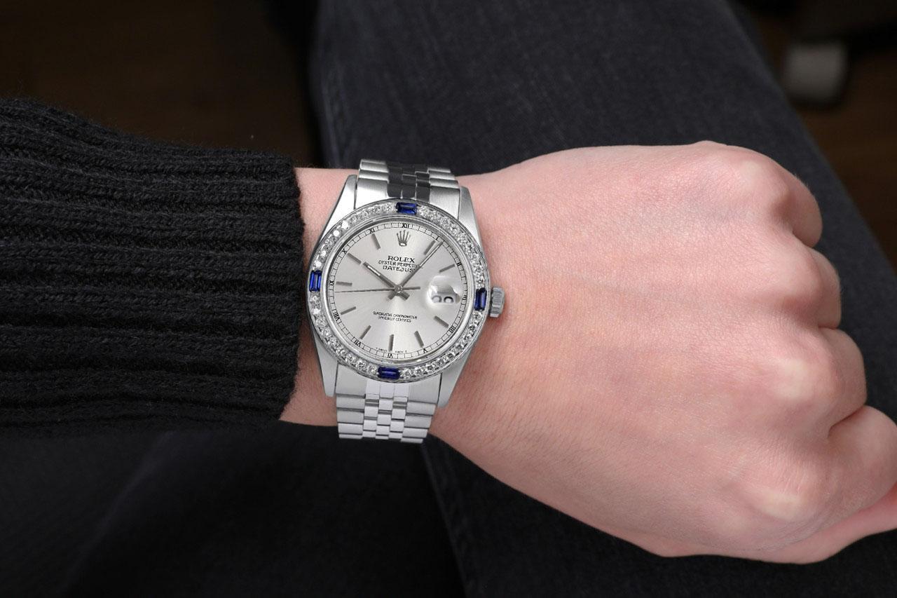 We take great pride in presenting this timepiece, which is in impeccable condition, having undergone professional polishing and servicing to maintain its pristine appearance. The watch features aftermarket diamonds (non-Rolex), and there are no