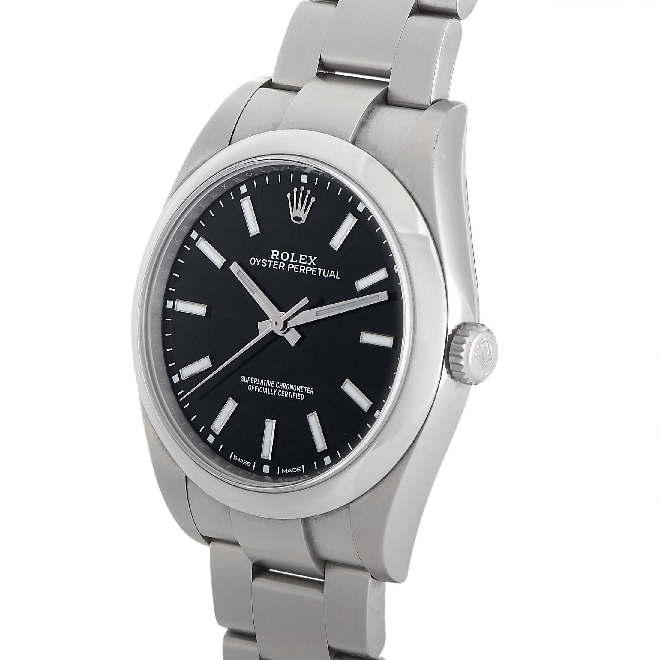 This Rolex Oyster Perpetual 39 mm Watch, reference number 114300-0005, features an oystersteel case measuring 39 mm in diameter. It is presented on a matching white oystersteel bracelet with deployant clasp. The black dial displays hours, minutes,