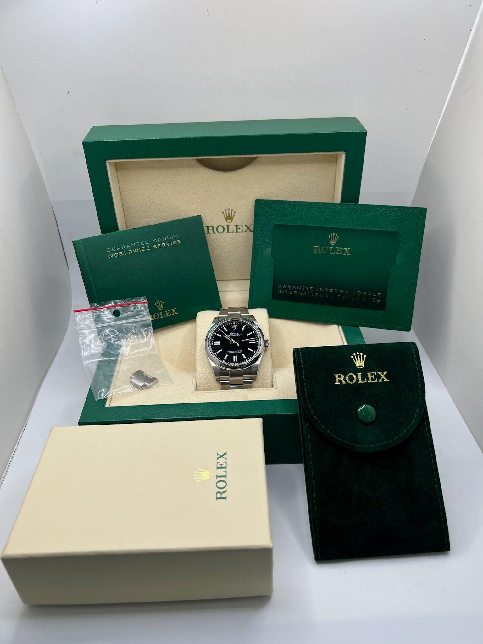 Experience timeless elegance with this Rolex Oyster Perpetual 41, reference 124300, released in 2022. A perfect embodiment of Rolex’s signature precision and understated style, this timepiece is crafted from durable Oystersteel and features a 41mm