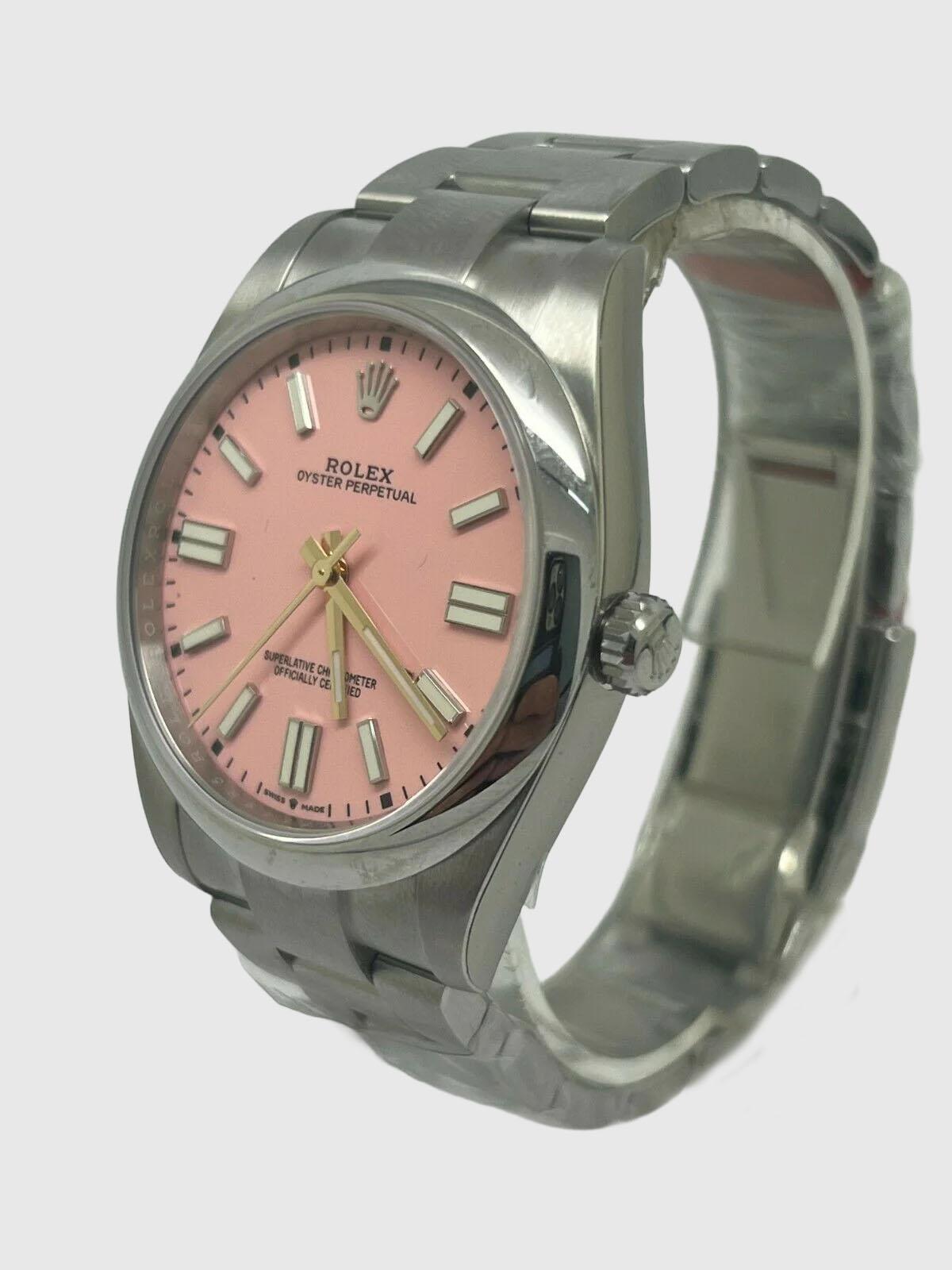 Presenting the exquisite 41mm Rolex Oyster Perpetual, model 124300, with its distinctive pink dial. For peace of mind, this watch comes with a full 5-year Rolex warranty and is brand new, having been manufactured in 2022. Please take note that