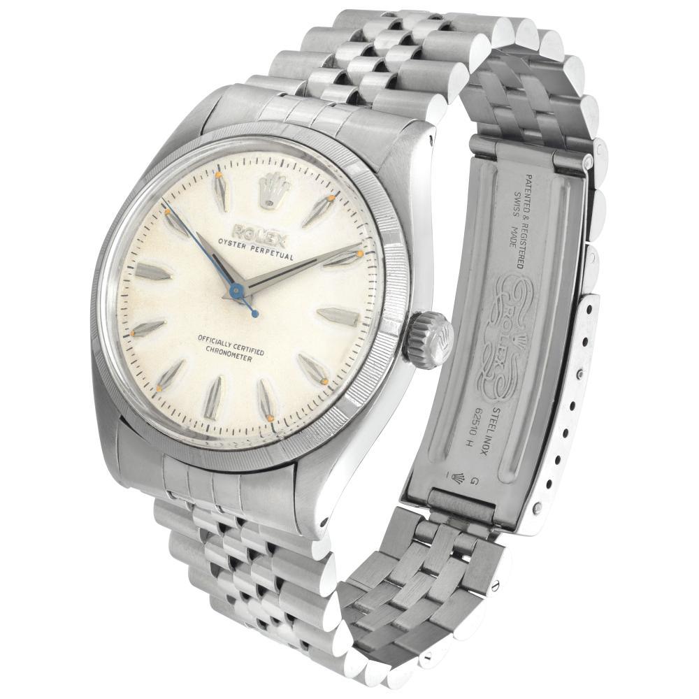 Vintage Rolex Oyster Perpetual in stainless steel with refinished dial and added modern jubilee bracelet. Auto w/ sweep seconds. 34 mm case size. Ref 6565. Circa 1955 *Bank Wire Only At This Price** Fine Pre-owned Rolex Watch. Certified preowned