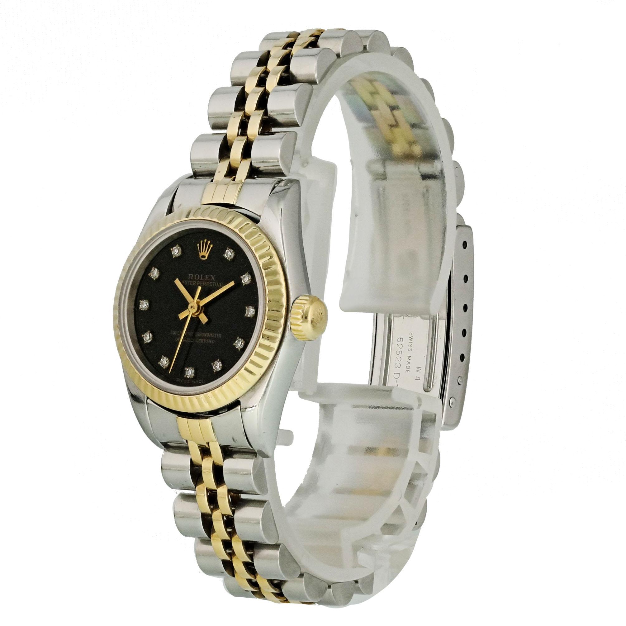 Rolex Oyster Perpetual 67193 Ladies Watch. 
24mm Stainless Steel case. 
Yellow Gold Stationary bezel. 
Black dial with gold hands and factory set diamond hour markers. 
Minute markers on the outer dial. 
Stainless Steel Bracelet with Fold Over