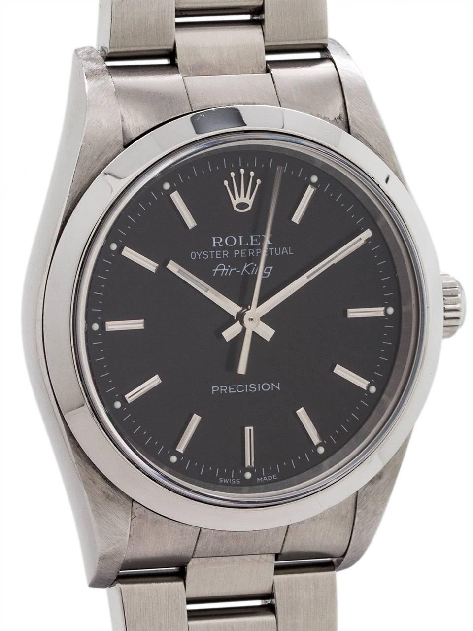 
Rolex Oyster Perpetual Airking ref 14000M serial# D6 circa 2005. 34mm diameter case with smooth bezel and sapphire crystal and glossy black original dial with applied silver indexes with bright glow luminova dots and hands. Powered by self winding