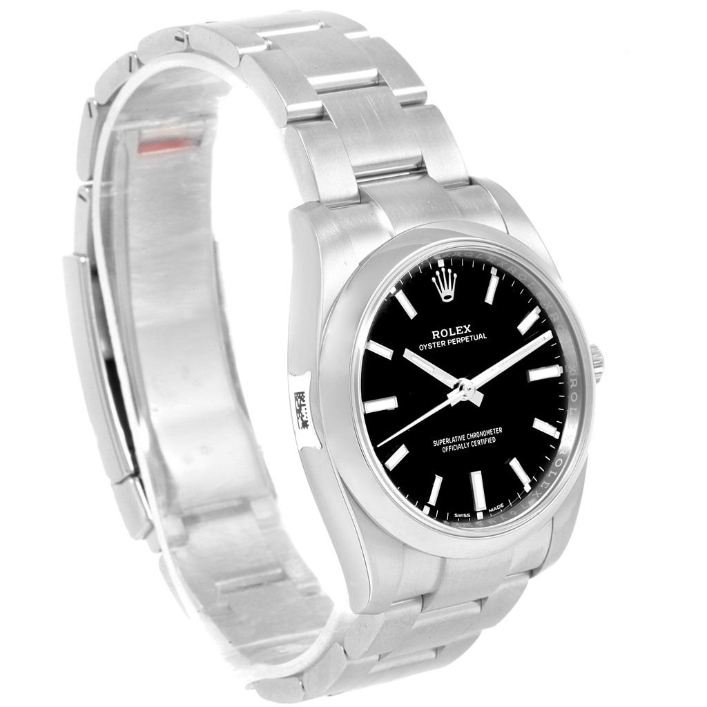 Rolex Oyster Perpetual Black Dial Domed Bezel Mens Watch 114200 Unworn. Officially certified chronometer self-winding movement. Stainless steel case 34 mm in diameter. Rolex logo on a crown. Stainless steel smooth domed bezel. Scratch resistant