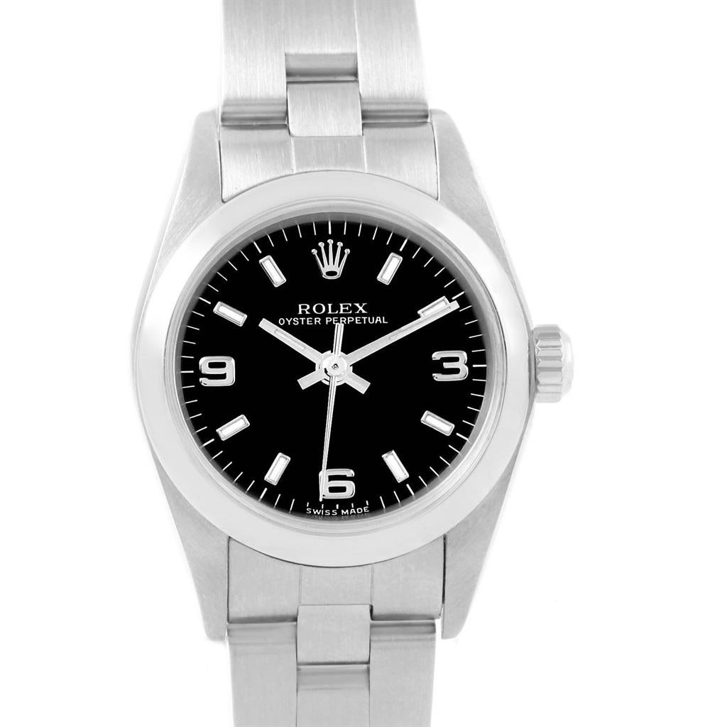 Rolex Oyster Perpetual Black Dial Oyster Bracelet Ladies Watch 76080. Officially certified chronometer self-winding movement. Stainless steel oyster case 24.0 mm in diameter. Rolex logo on a crown. Stainless steel smooth domed bezel. Scratch