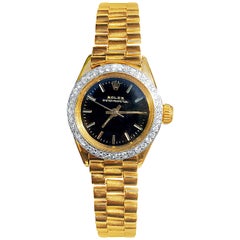 Vintage Rolex Oyster Perpetual Black Face/Diamond Bezel Rolex in 18k Yellow Gold