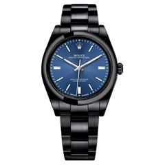 Rolex Montre Oyster Perpetual bleue avec cadran noir PVD/DLC en acier inoxydable revêtu 114300